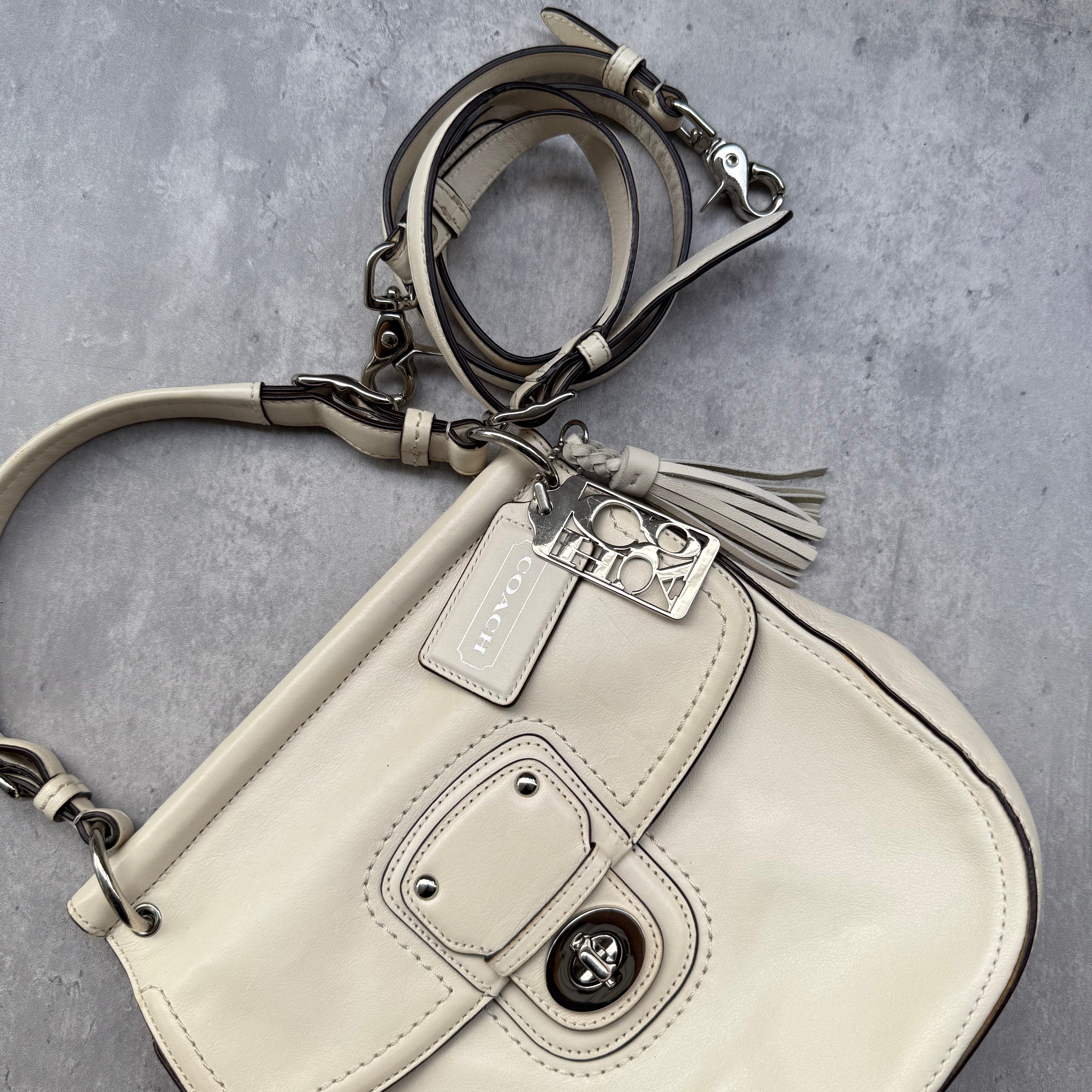 Coach Legacy Willis Tassel Handbag White with top handle, extra crossbody strap, and striped interior lining