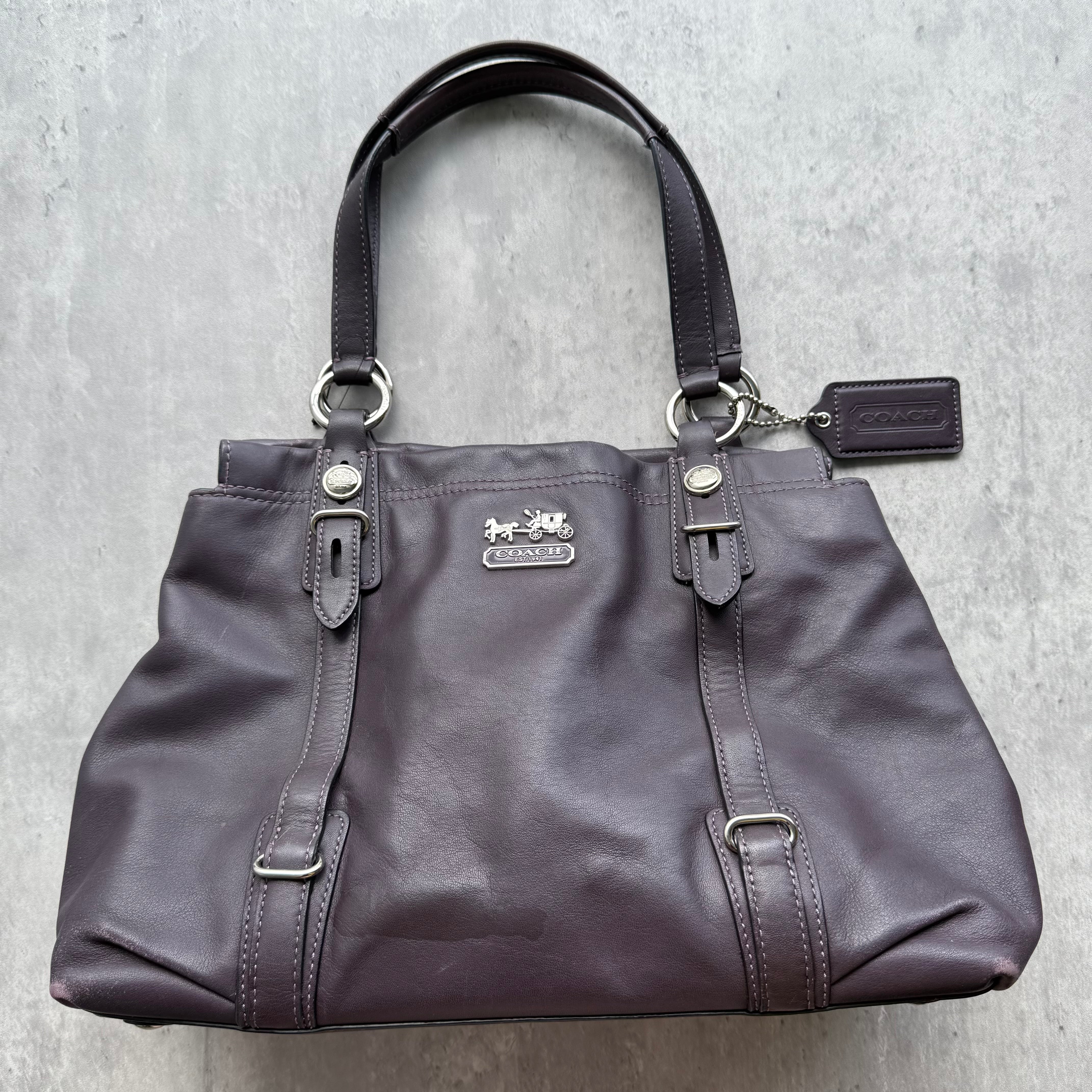 Coach Madison Mia Shoulder Bag in dark purple leather with silver-tone hardware, horse & carriage emblem, and light blue interior lining.