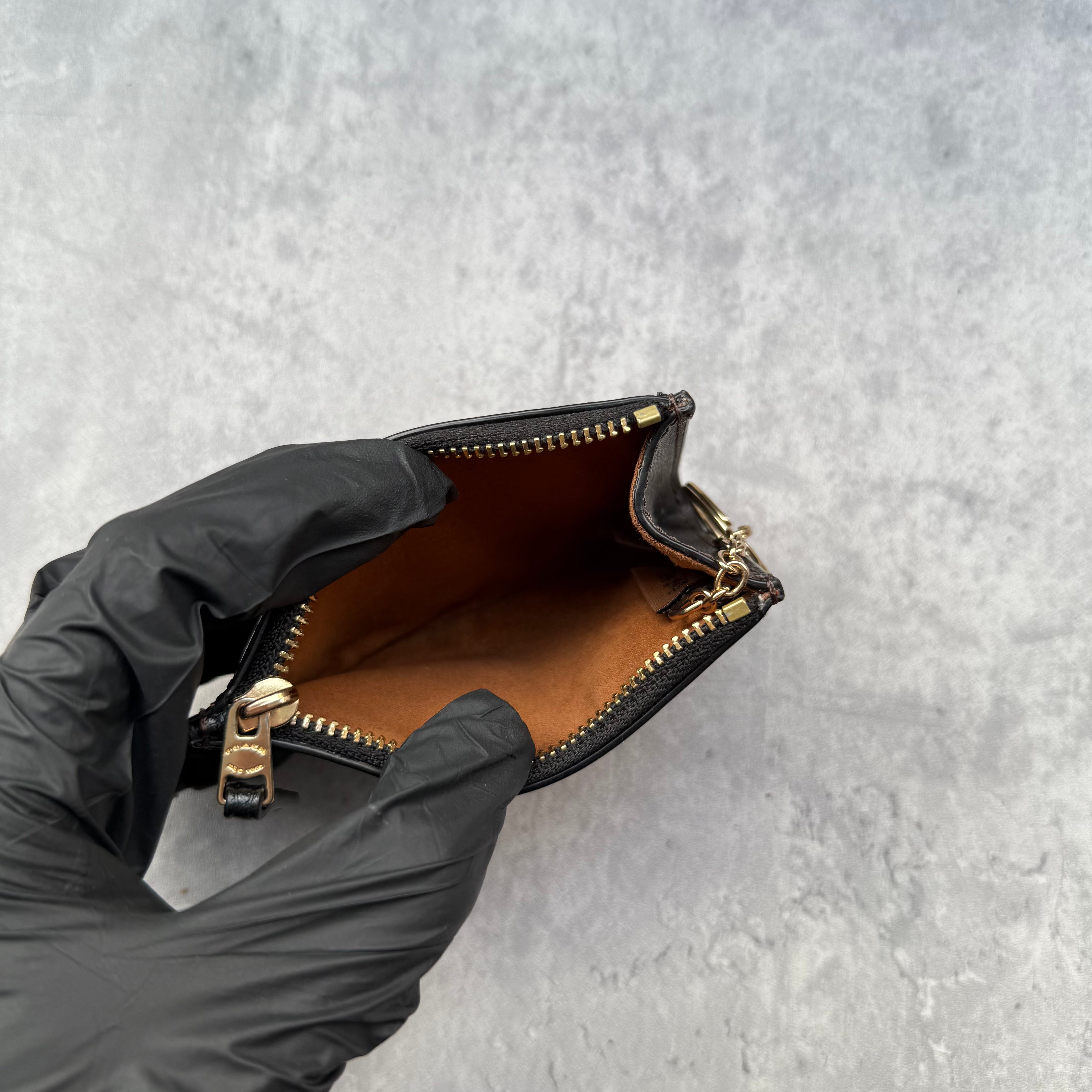 Coach Mini Skinny ID Cardholder in signature canvas with gold keyring, zip closure, and exterior ID window