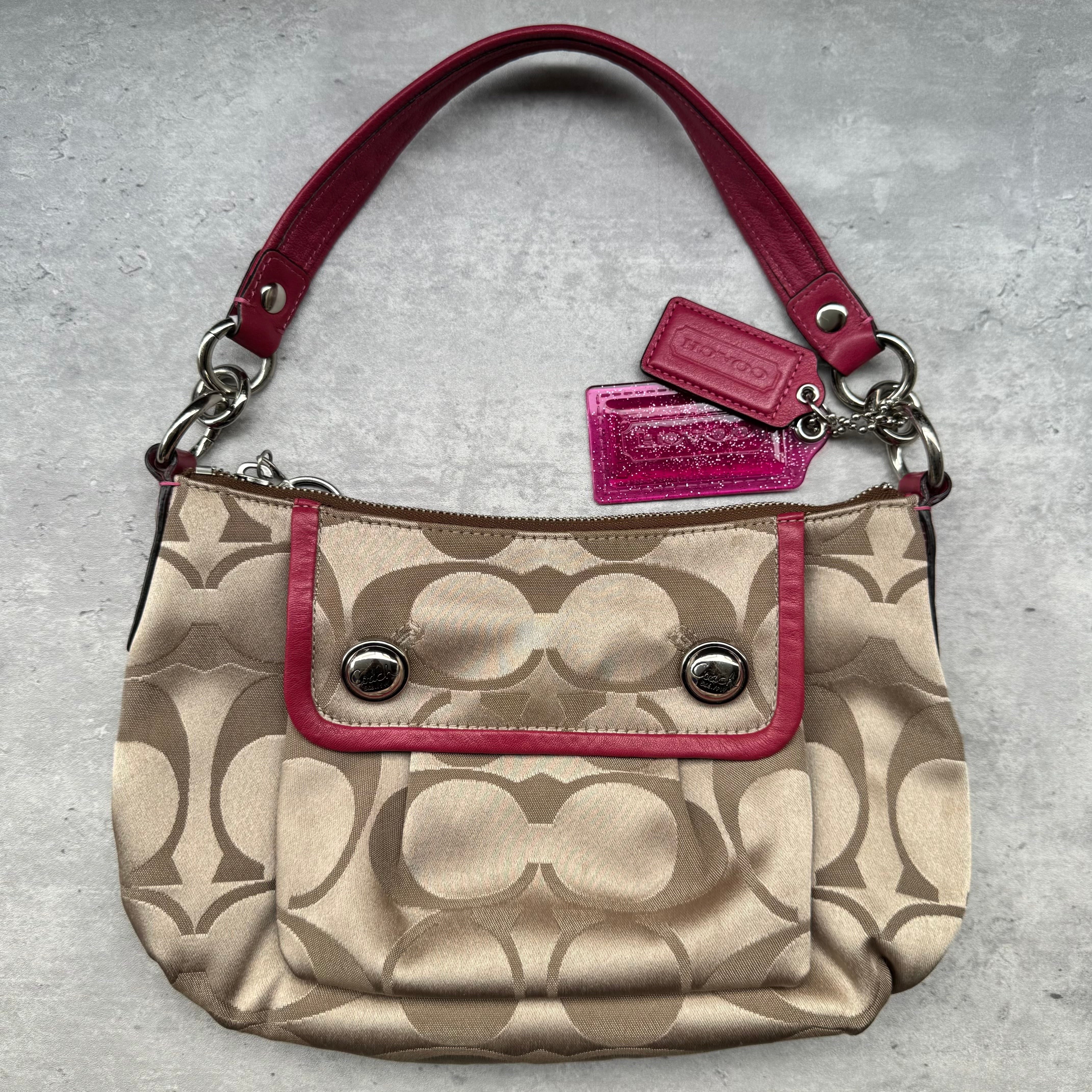 Coach Poppy Signature Sateen Groovy Shoulder Bag in Beige with Pink Trim, featuring satin canvas body, silver button details, glitter hangtag, and detachable pink-striped crossbody strap.