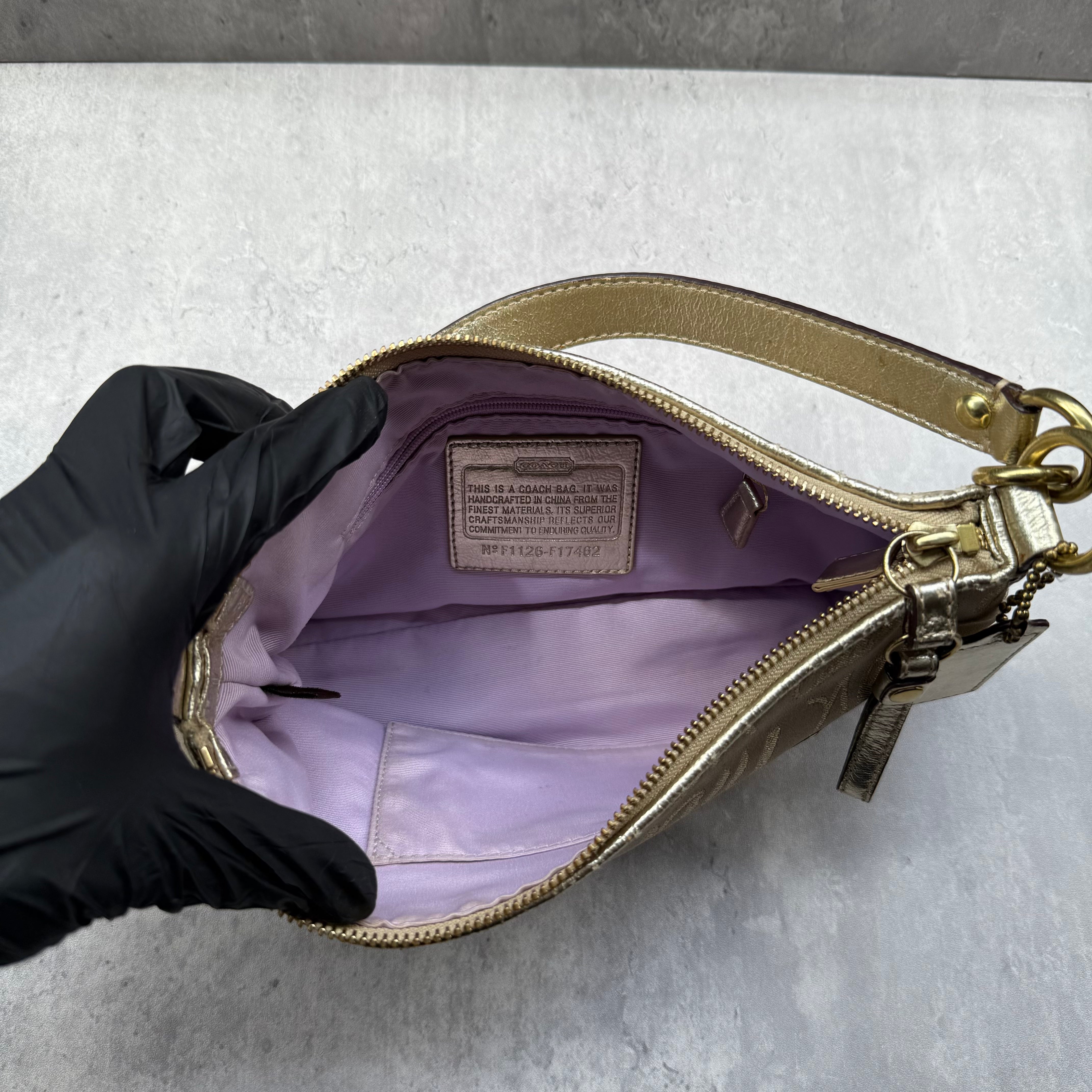 Coach Script Heart Shoulder Bag in beige satin with crystal heart charm, lavender interior, and gold-tone hardware.