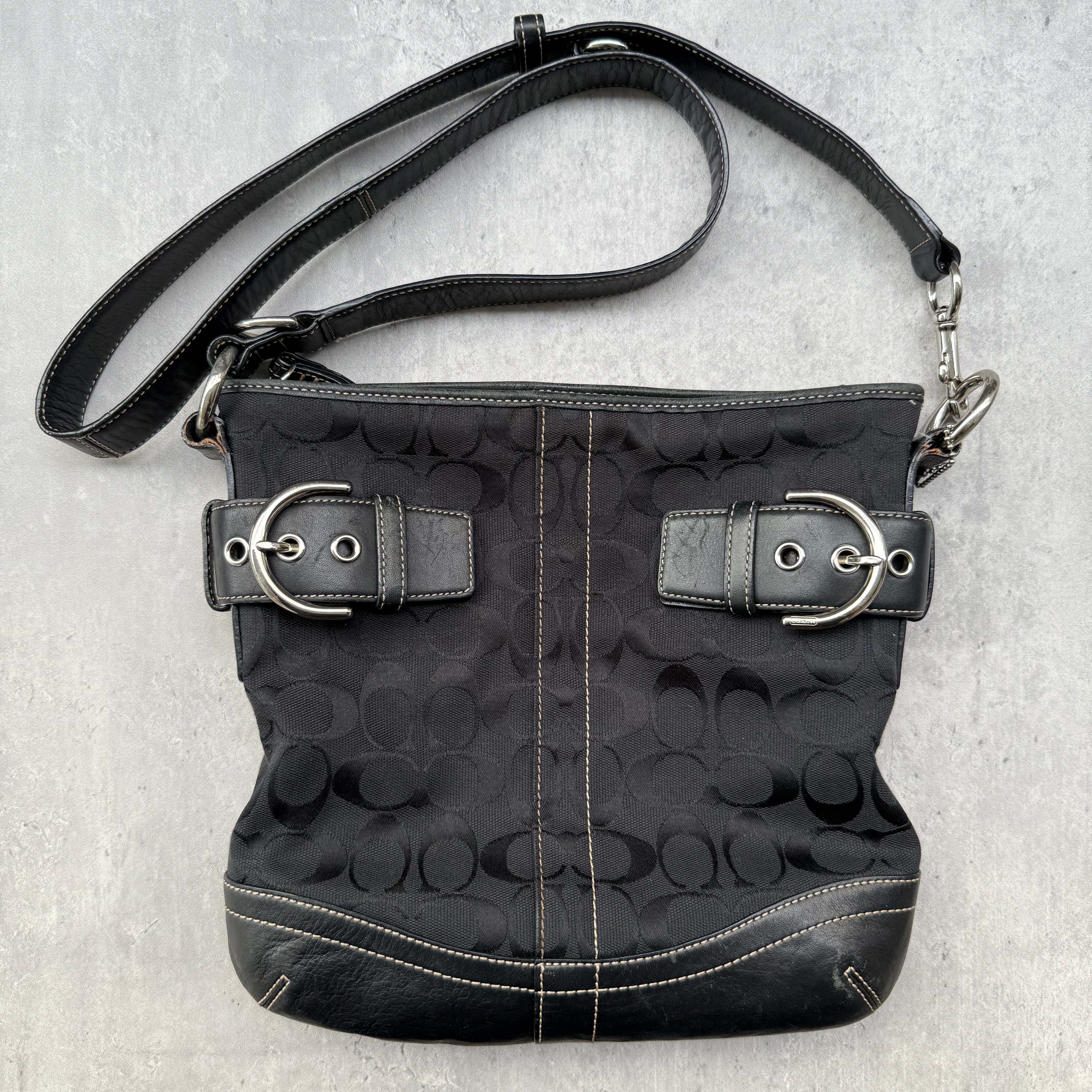 Coach Signature Canvas Crossbody Bag Black with leather trim, dual buckle detail, and silver-tone hardware