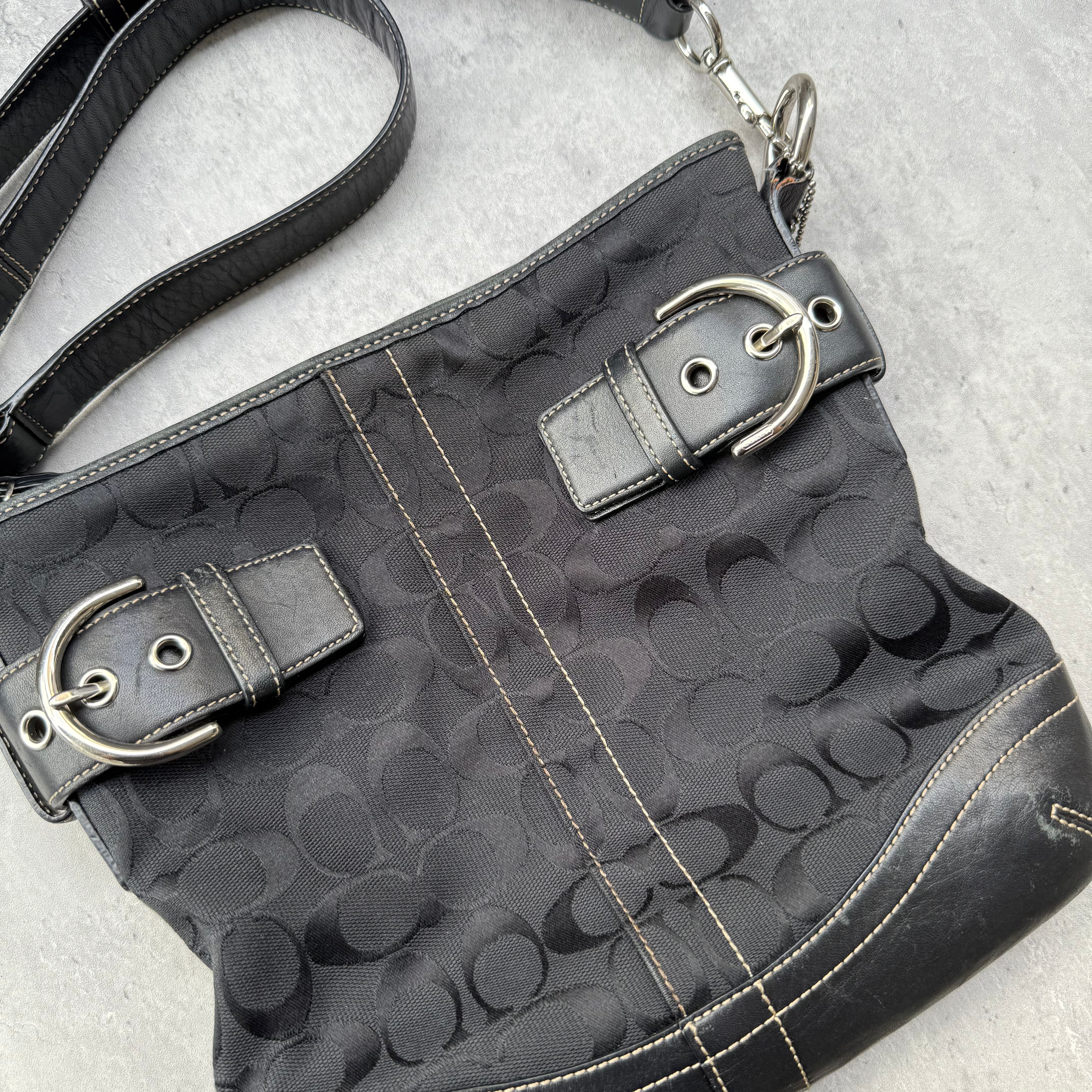 Coach Signature Canvas Crossbody Bag Black with leather trim, dual buckle detail, and silver-tone hardware