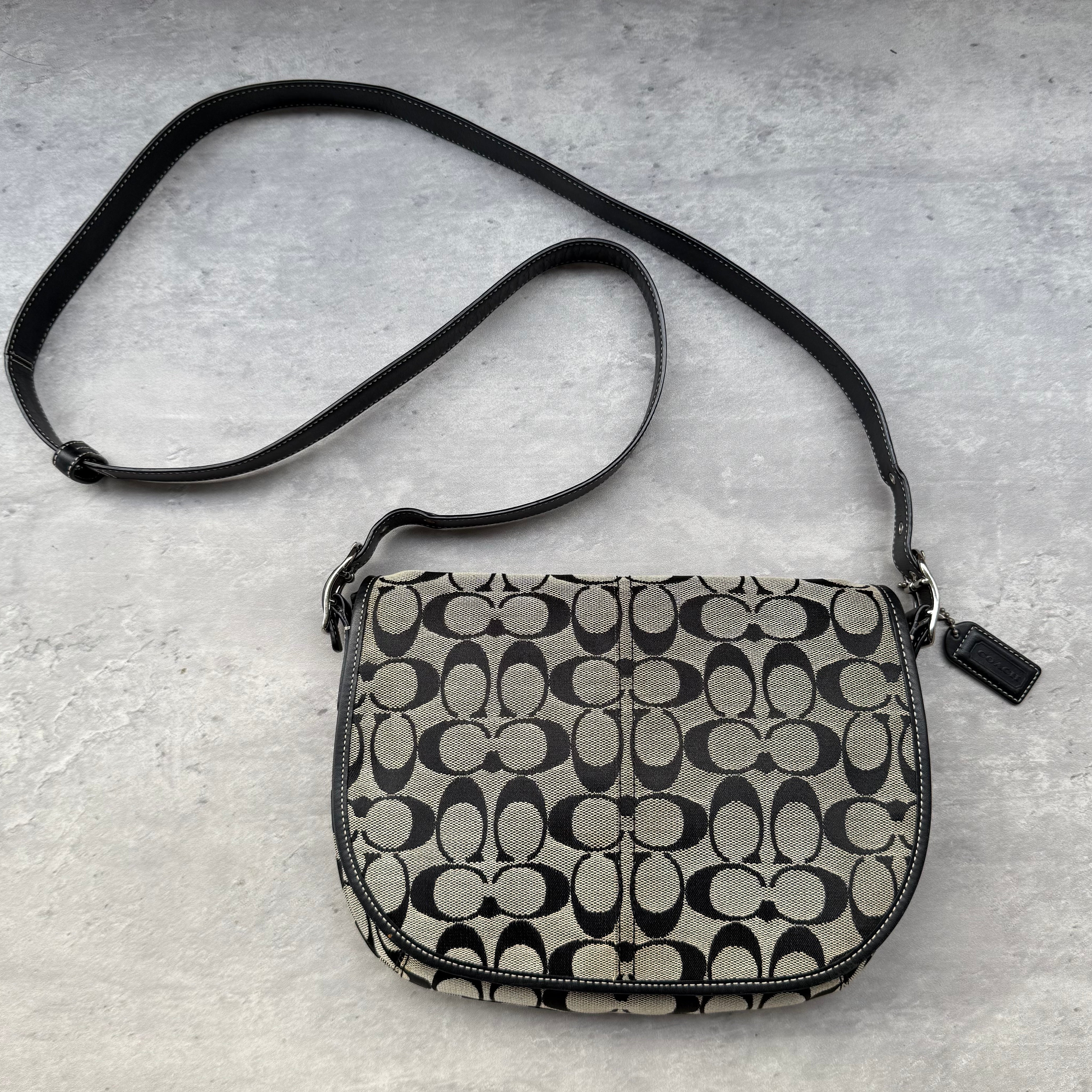 Coach Signature Canvas Crossbody Bag Black/Grey, crafted from coated canvas with leather trim, featuring flap closure and adjustable strap.