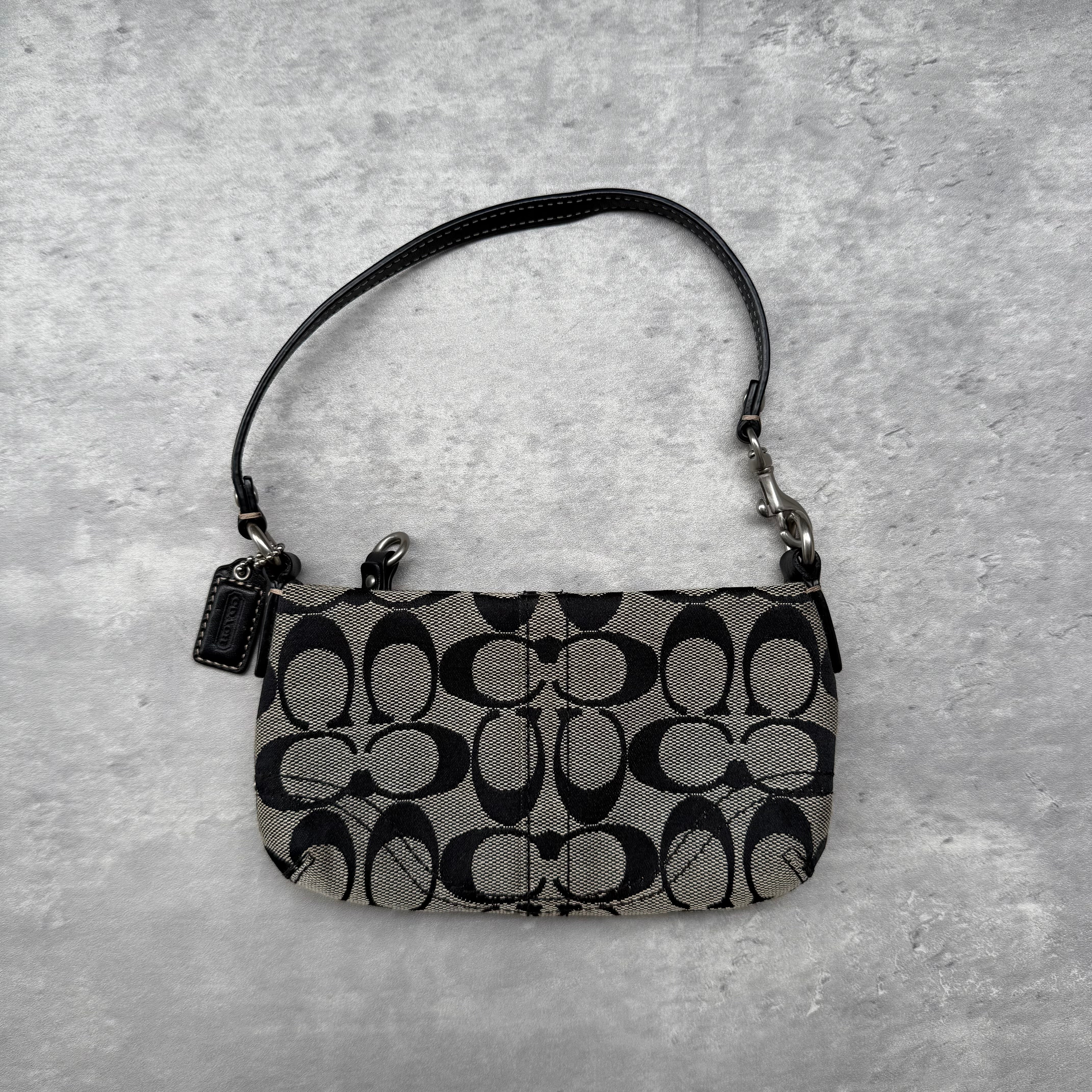 Coach Signature Canvas Mini Bag in black and grey monogram with detachable leather strap and burgundy fabric lining – pre-loved designer handbag.