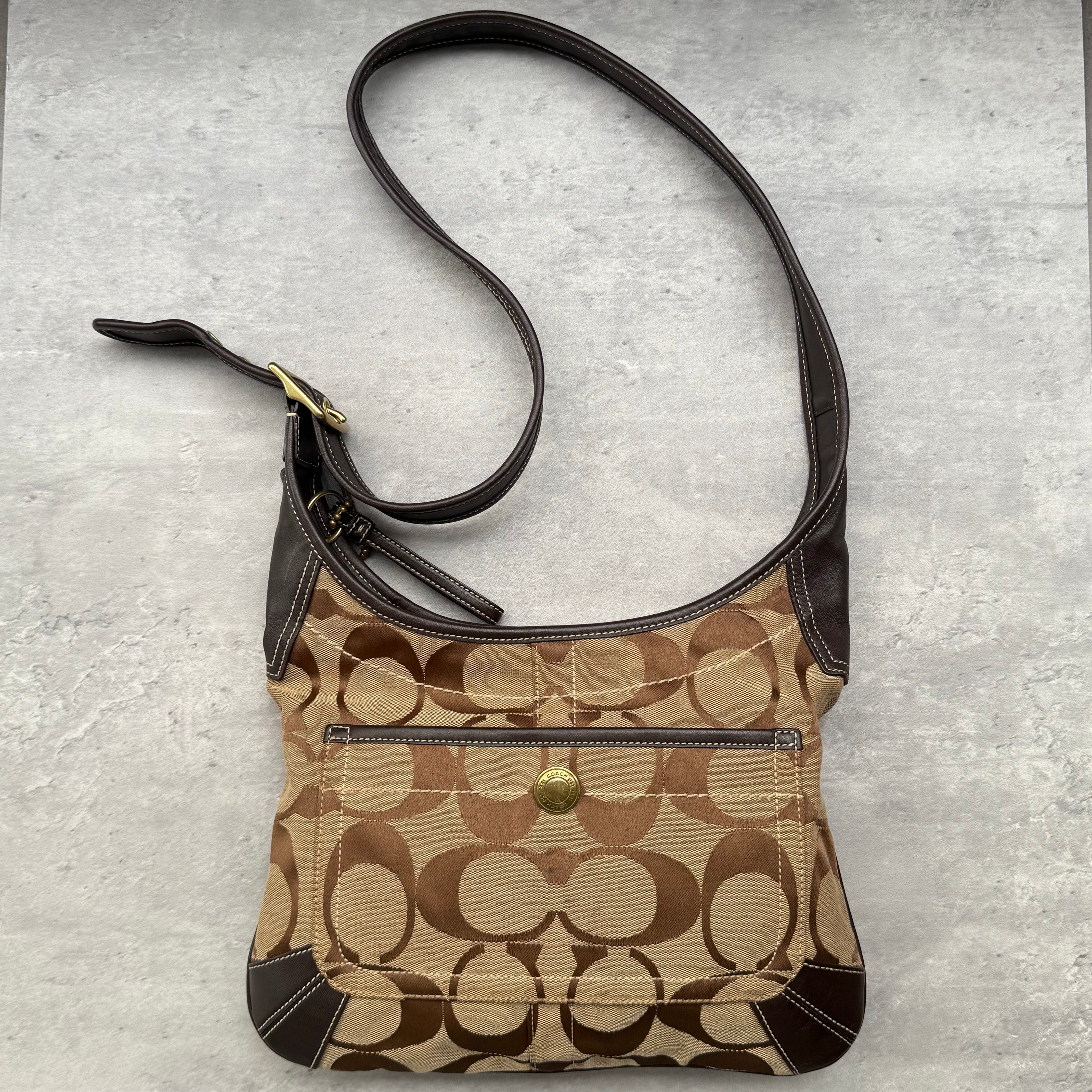 Coach Signature Ergo Hobo Crossbody Bag in beige and brown, crafted from jacquard canvas with leather trim and gold-tone hardware.