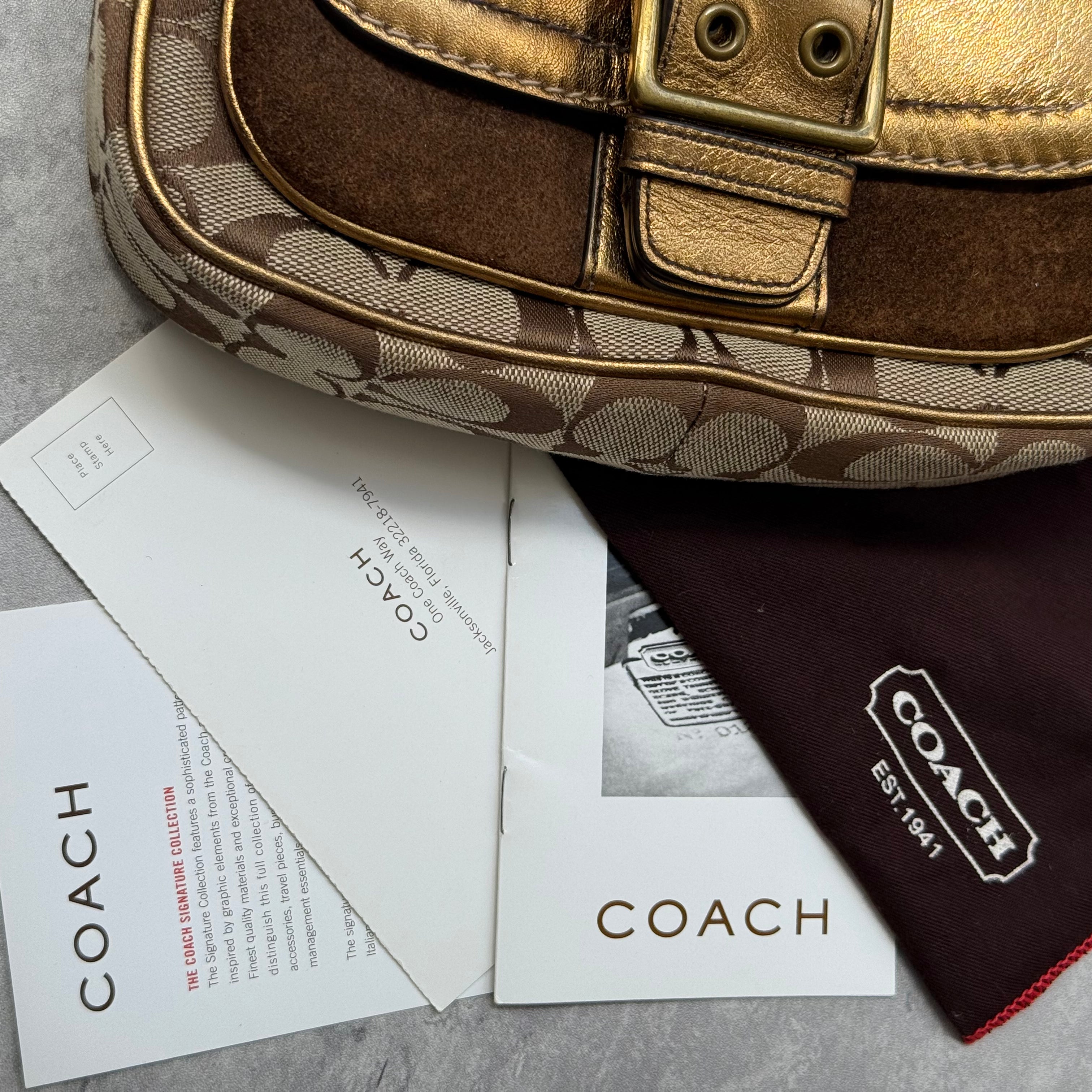 Coach Signature Shoulder Bag in beige canvas with gold metallic front buckle pocket, brown suede accents, and short strap.