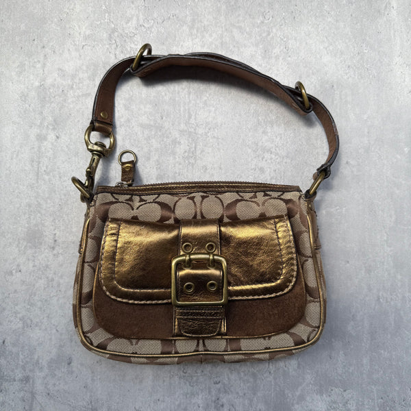 Coach Signature Shoulder Bag in beige canvas with gold metallic front buckle pocket, brown suede accents, and short strap.
