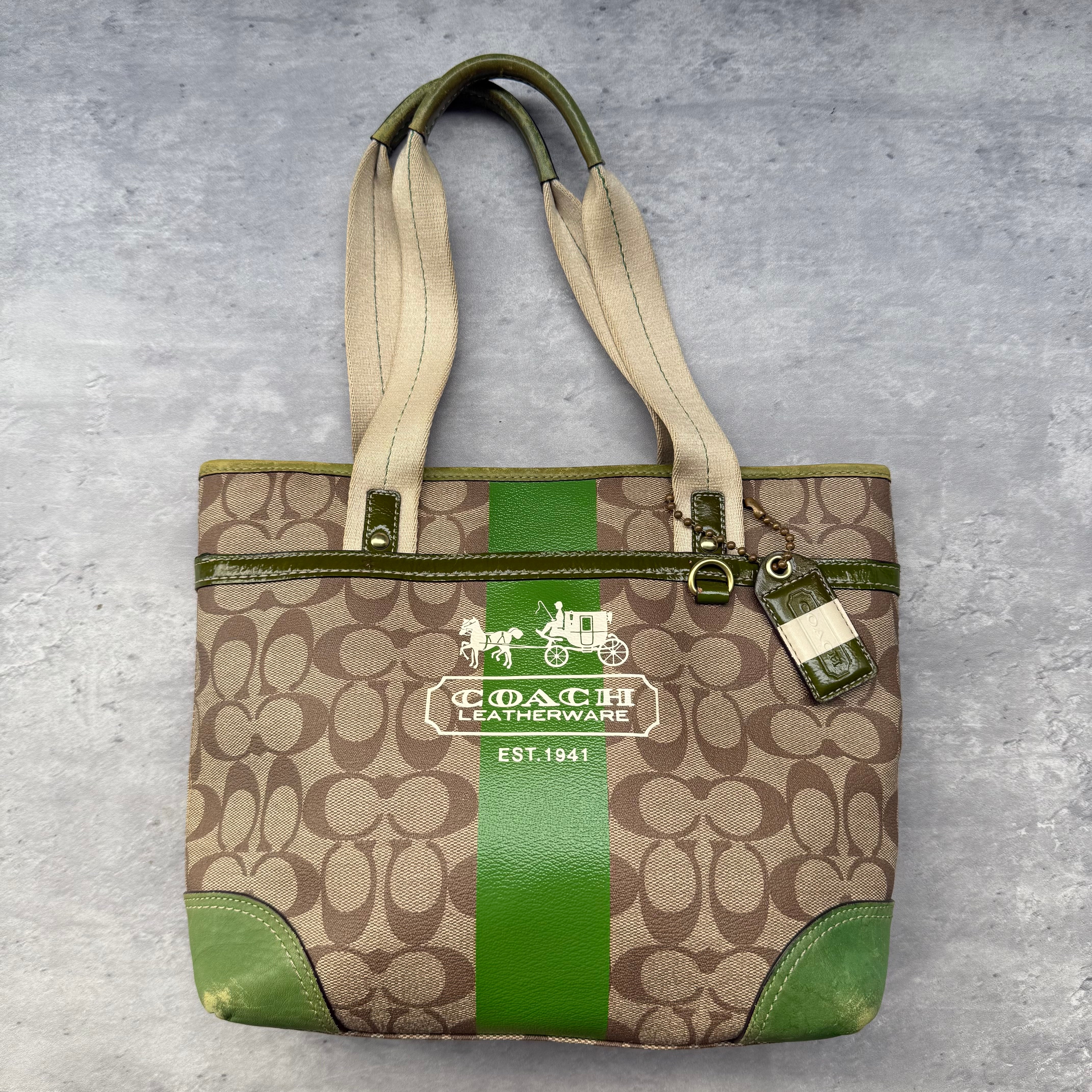 Coach Signature Heritage Stripe Tote Bag Beige with Green accents, featuring classic monogram canvas, leather trim, and plaid interior lining.