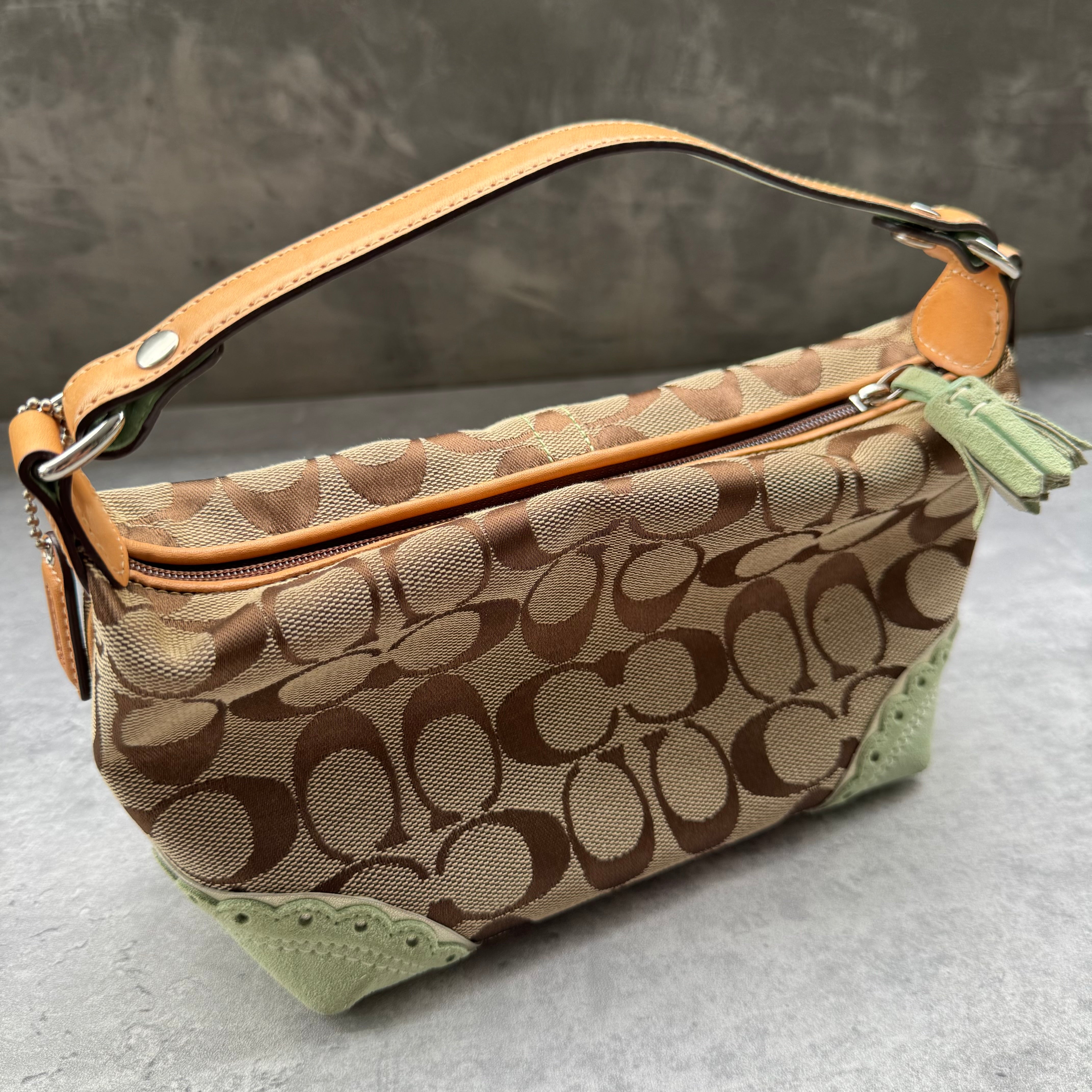 Coach Signature Mini Hobo Shoulder Bag in beige canvas with mint green suede trim and monogram design.