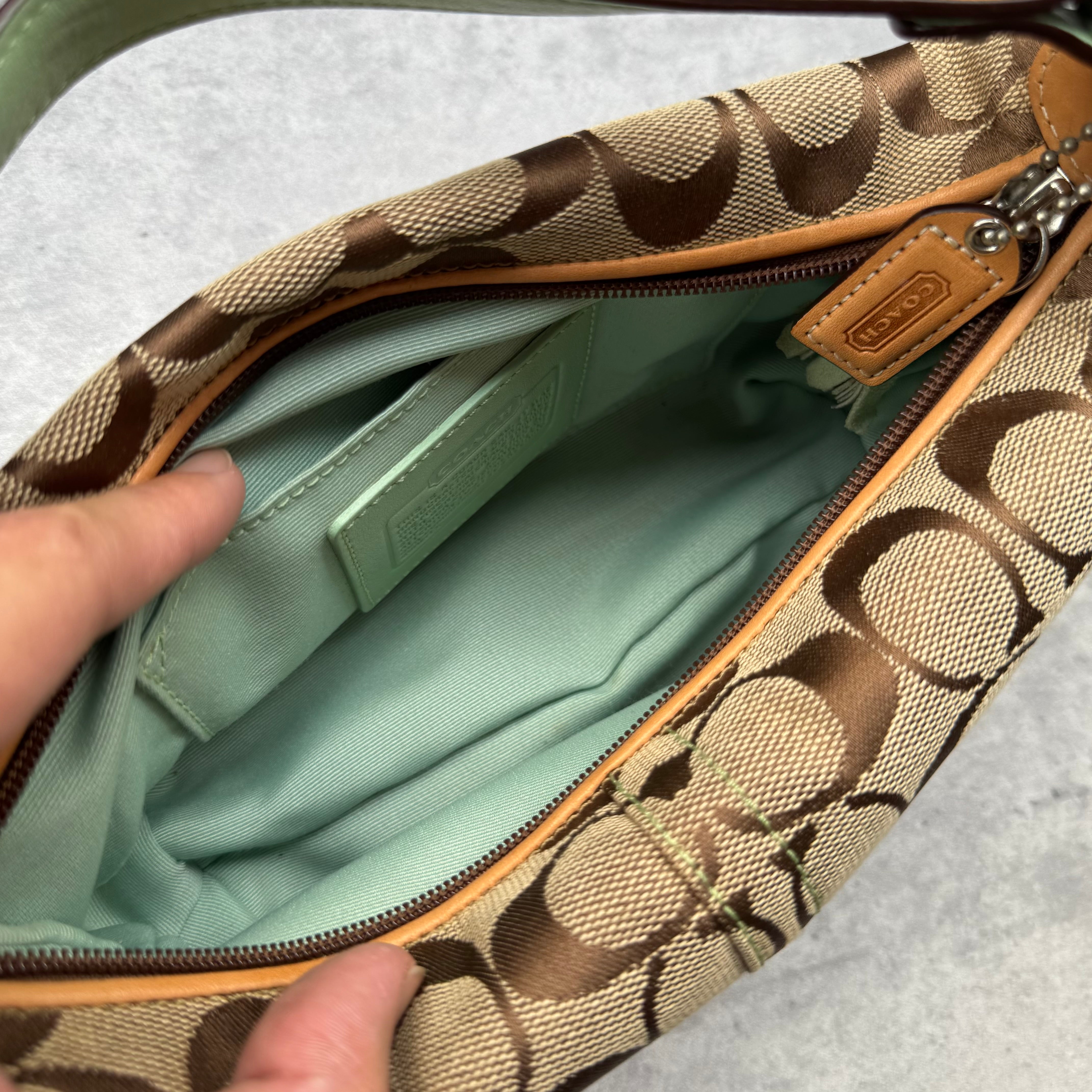 Coach Signature Mini Hobo Shoulder Bag in beige canvas with mint green suede trim and monogram design.