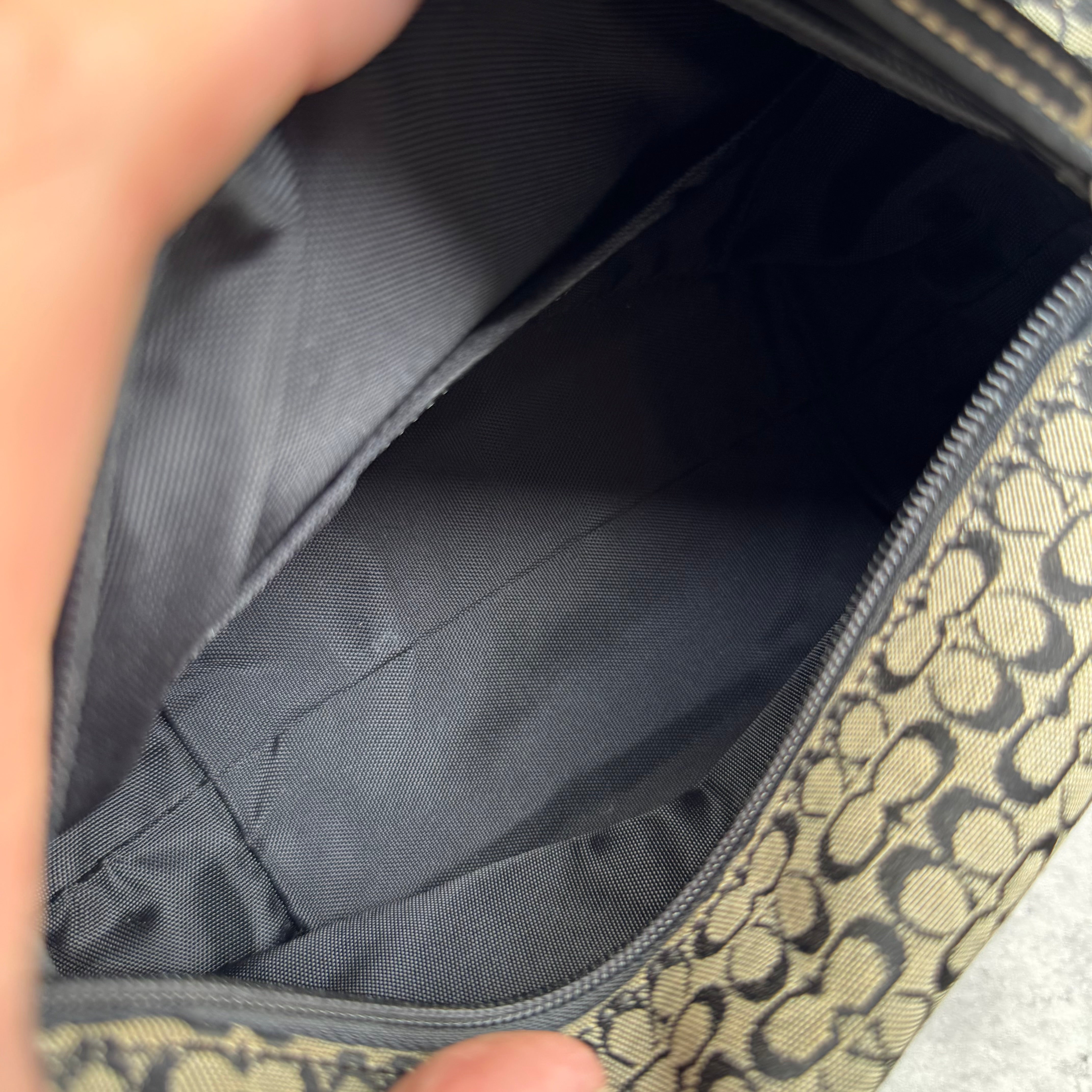 Coach Signature Mini Hobo Shoulder Bag in grey and black canvas with monogram print and black leather trim.