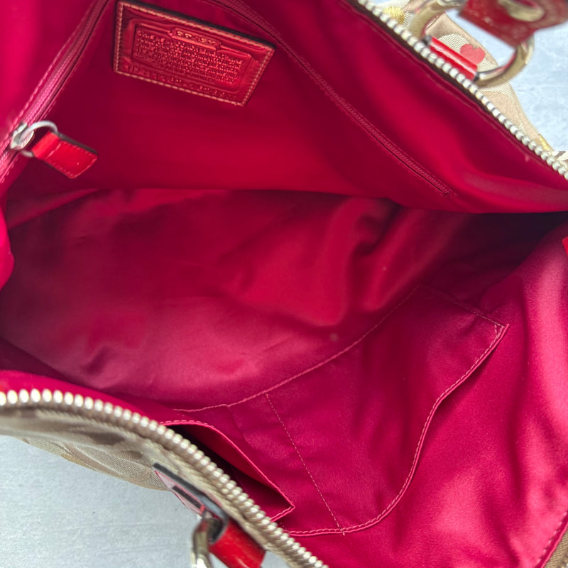 Coach Signature Poppy Laura Secret Admirer Tote Bag in brown monogram canvas with red and gold heart dot accents and red patent leather trim.