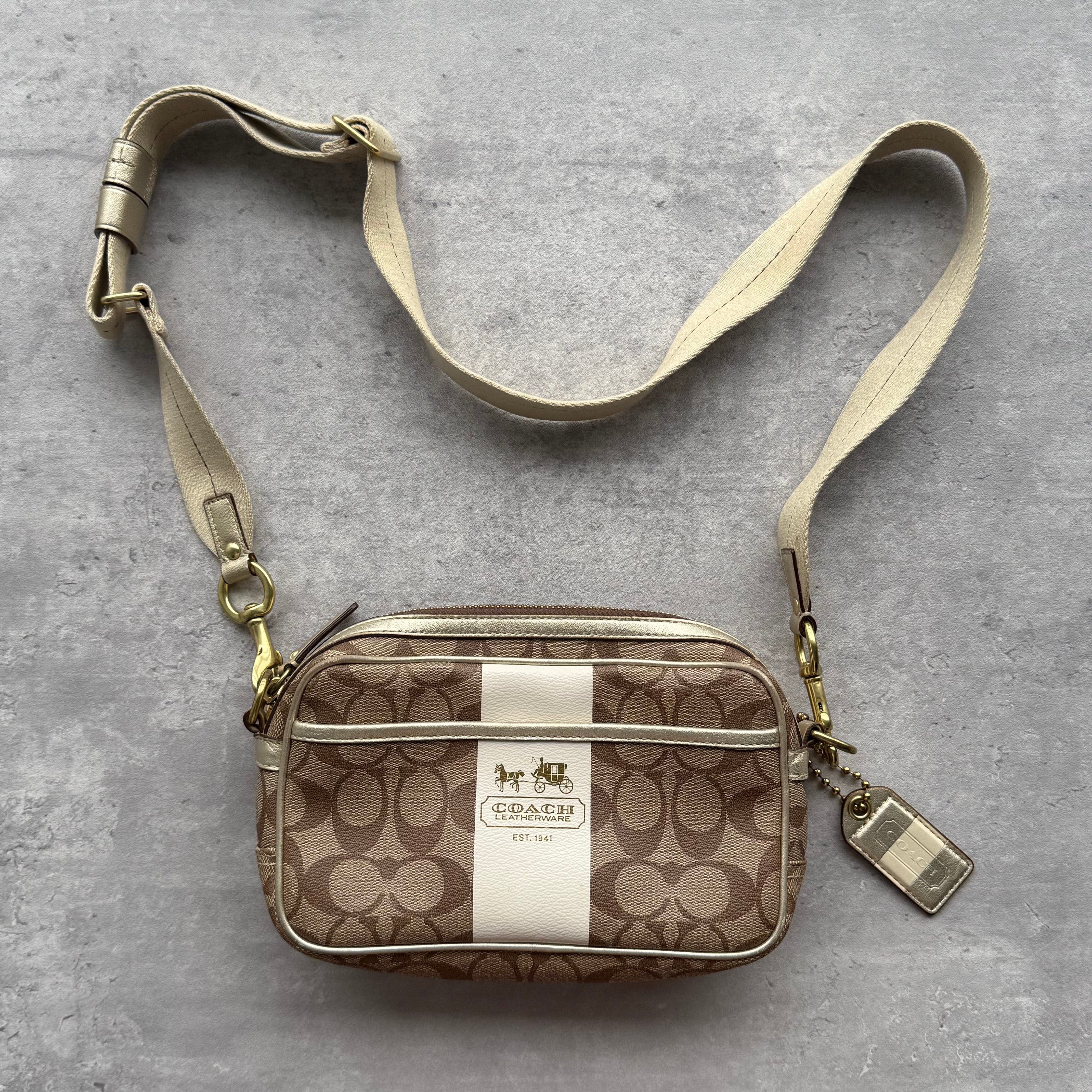 Coach Signature Stripe Jaime Crossbody Bag in beige jacquard with white stripe, brass-tone hardware, front pocket, and adjustable strap