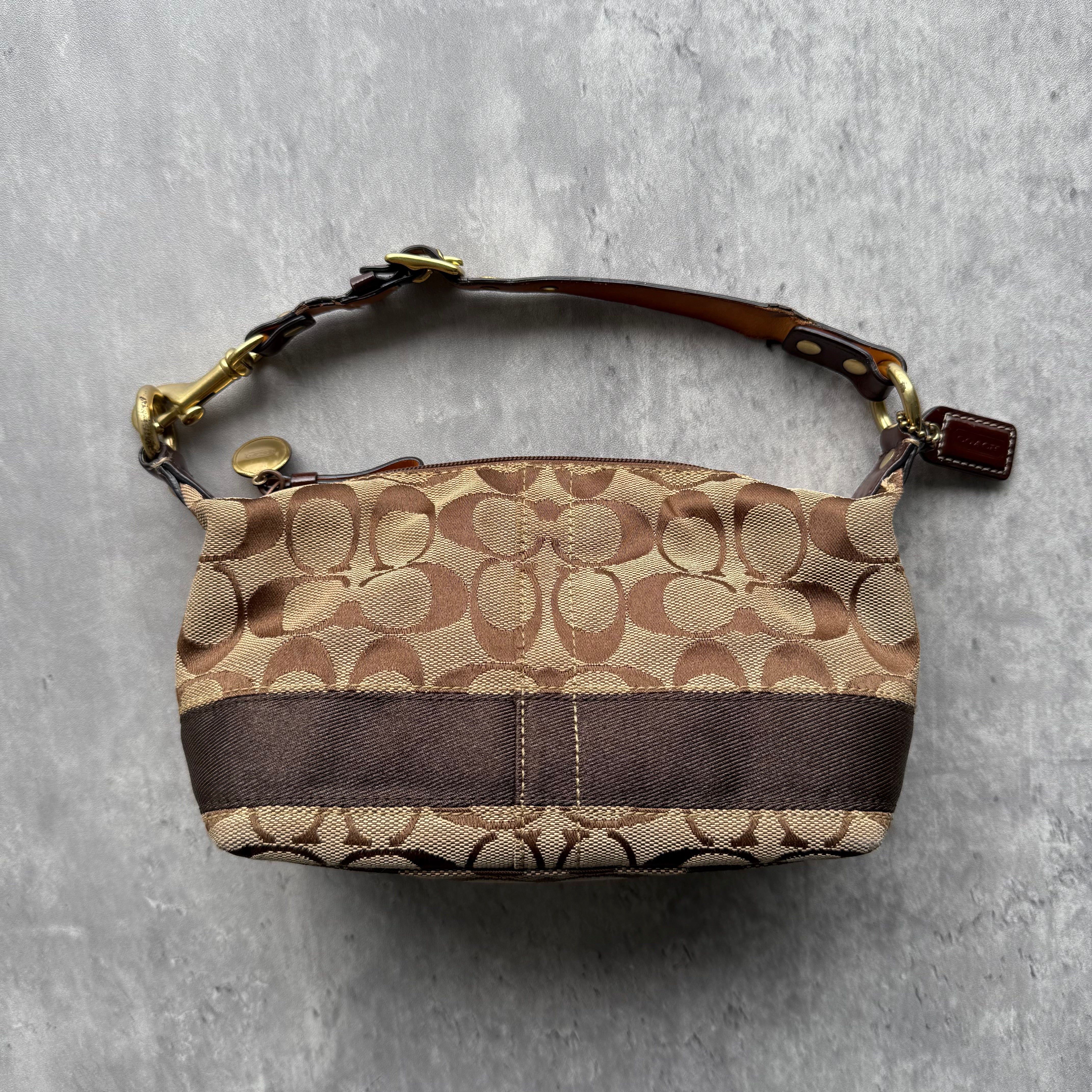 Coach Signature Stripe Mini Hobo Shoulder Bag in beige and brown jacquard with adjustable strap and gold-tone hardware