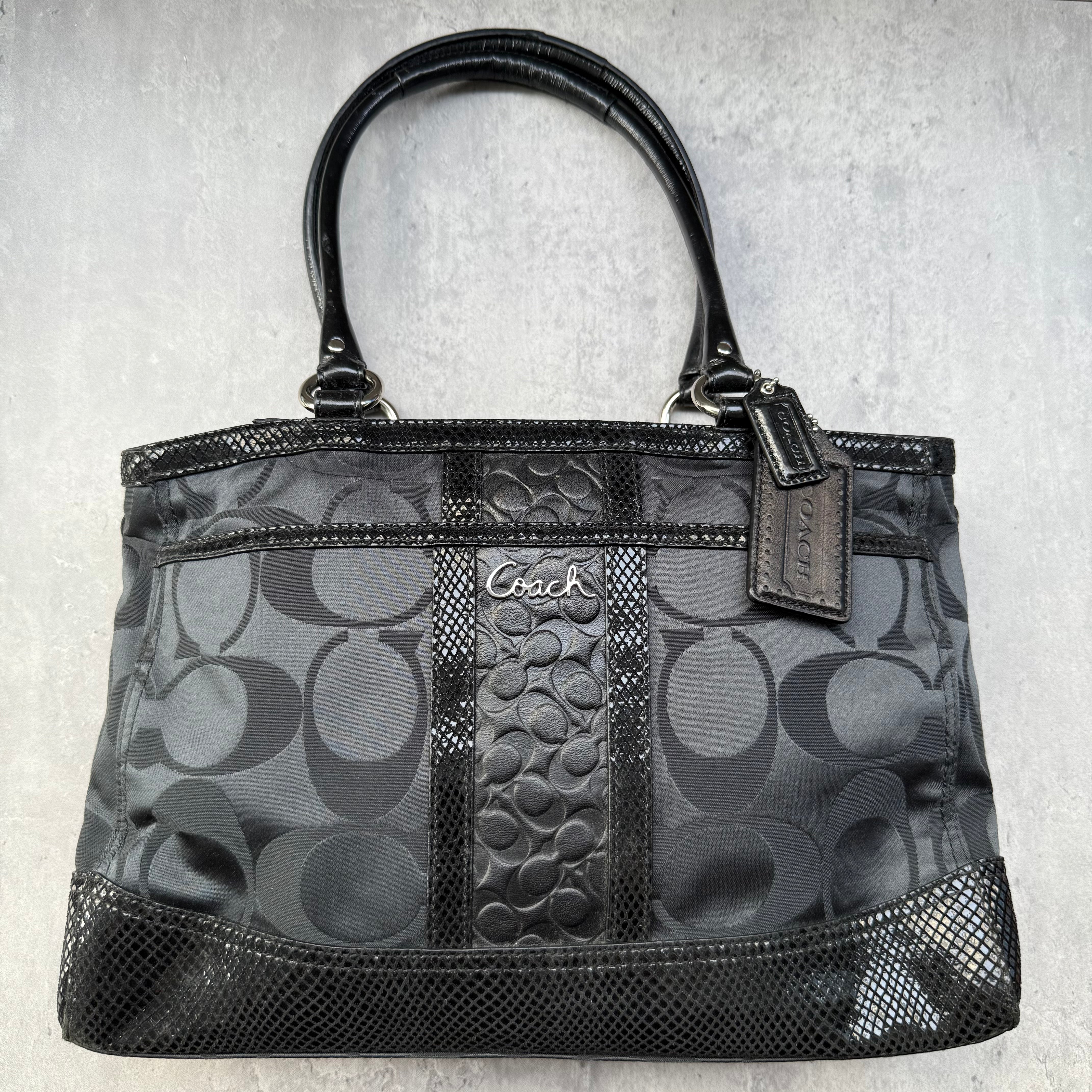 Coach Signature Stripe Park HandBag in black jacquard canvas with leather trim and stripe detailing.