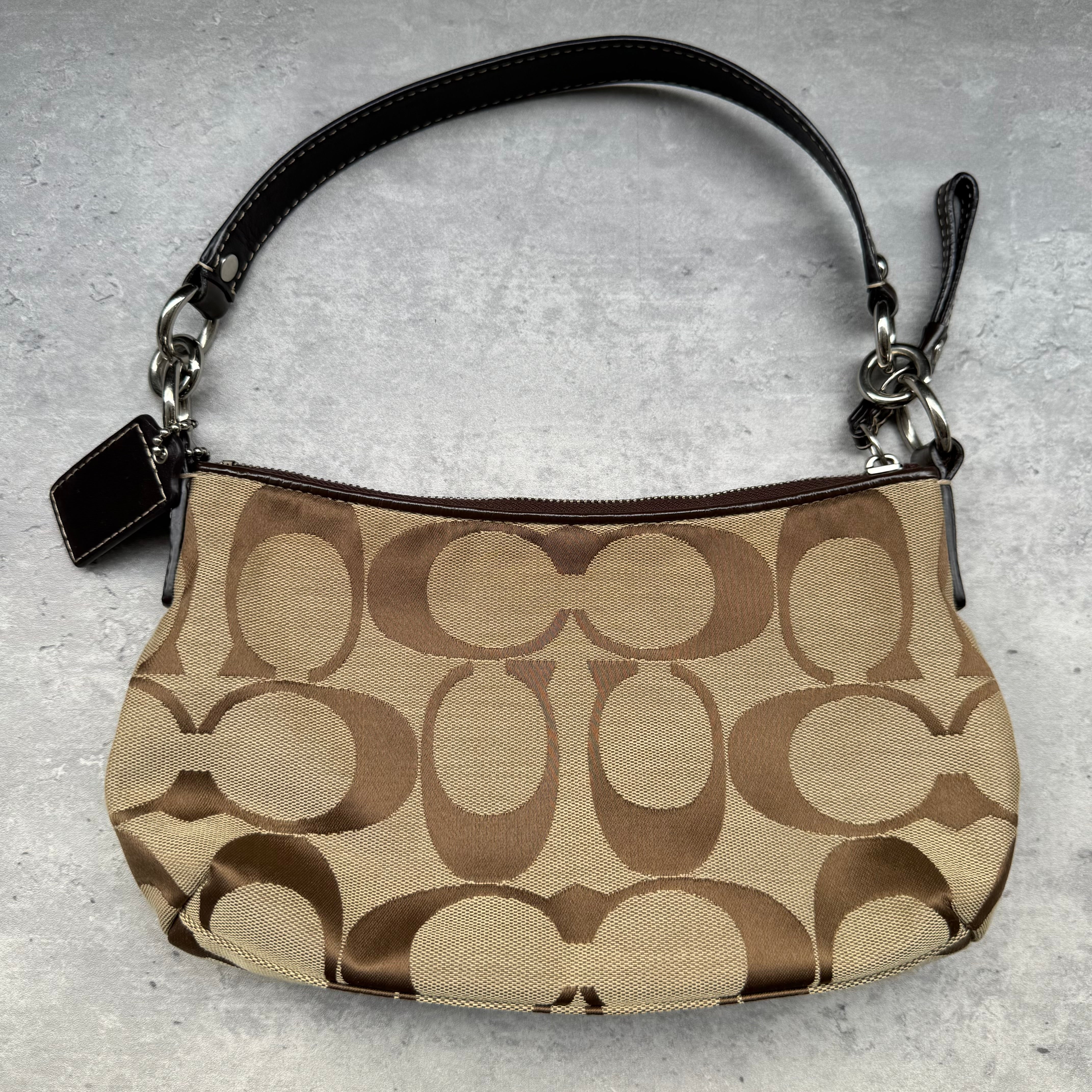 Coach Signature Stripe Shoulder Bag in beige and brown monogram canvas with dark brown leather trim and detachable strap.