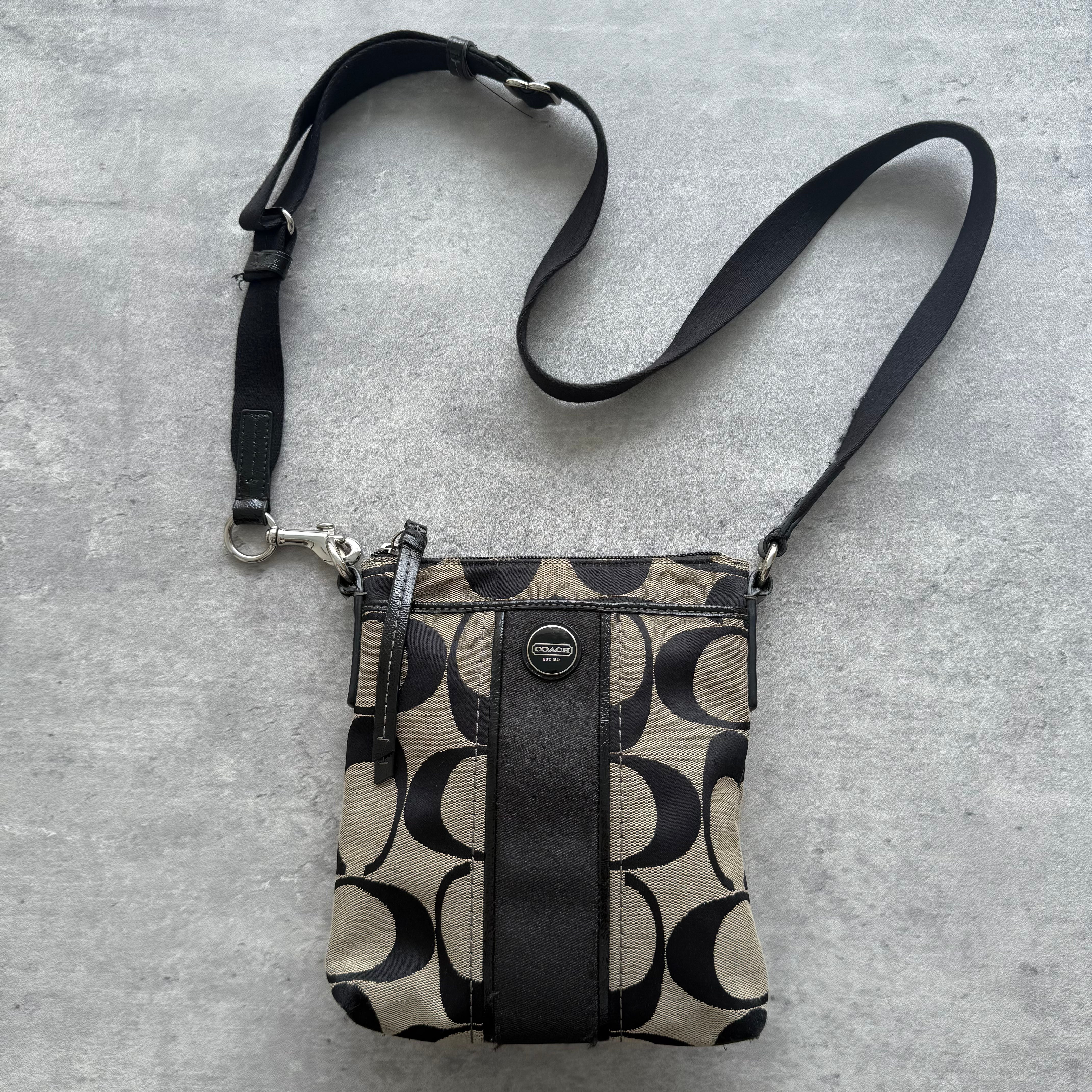 Coach Signature Stripe Swingpack Crossbody Bag in grey and black, crafted from jacquard canvas with leather trim and silver-tone hardware.