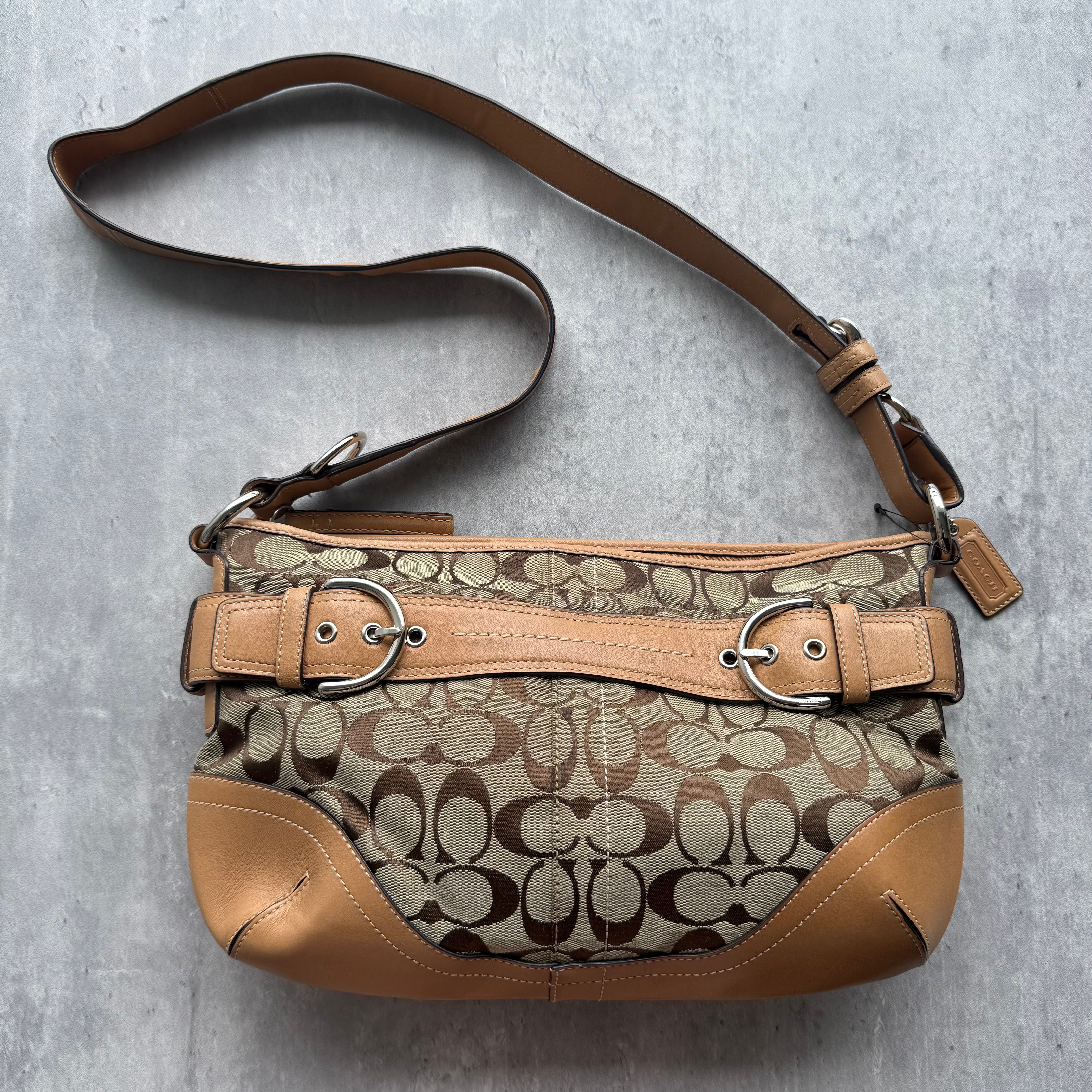 Coach Signature Sufflette Crossbody Bag in beige canvas with tan leather trim, silver-tone hardware, and adjustable crossbody strap.