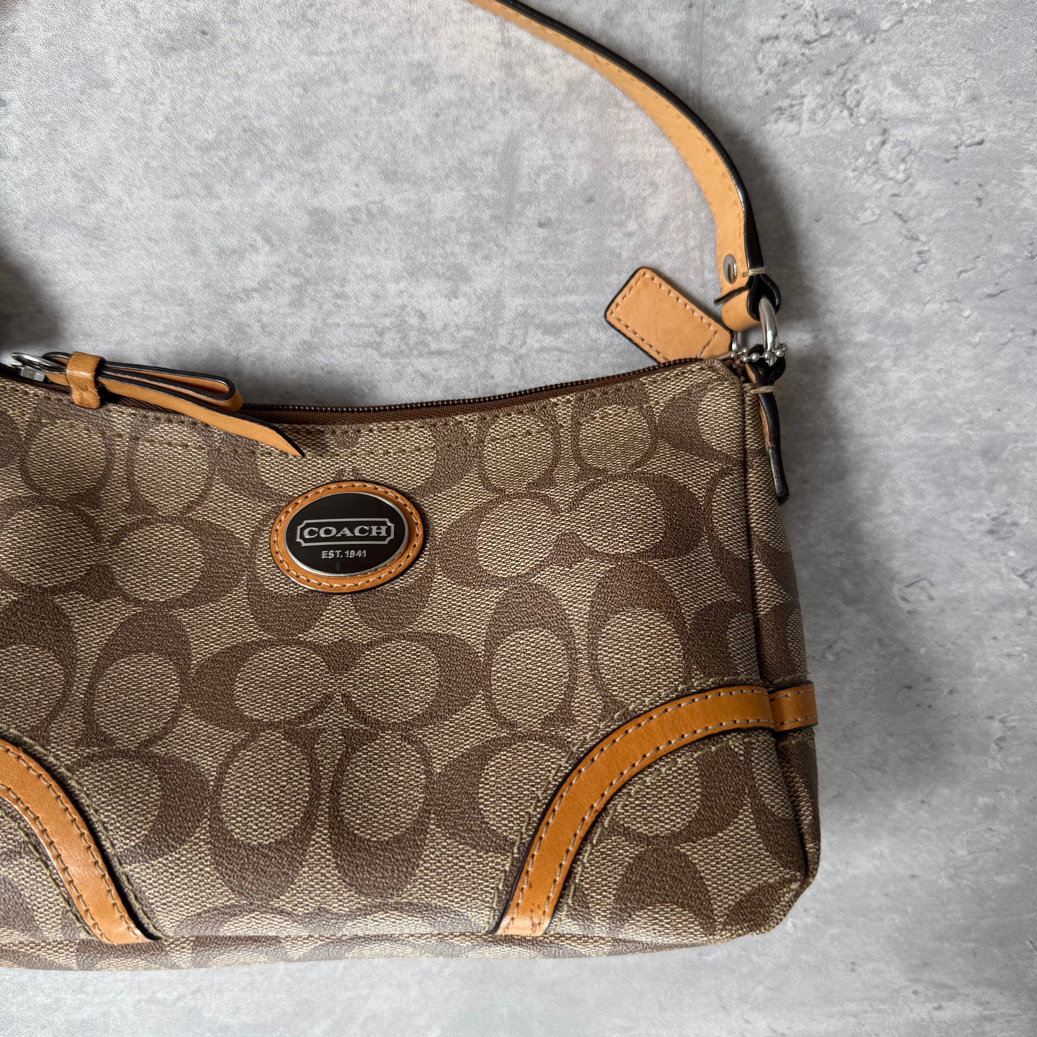 Coach Signature Sufflette Leather Shoulder Bag in beige with monogram canvas, tan leather trim, zip-top closure, and interior slip pocket