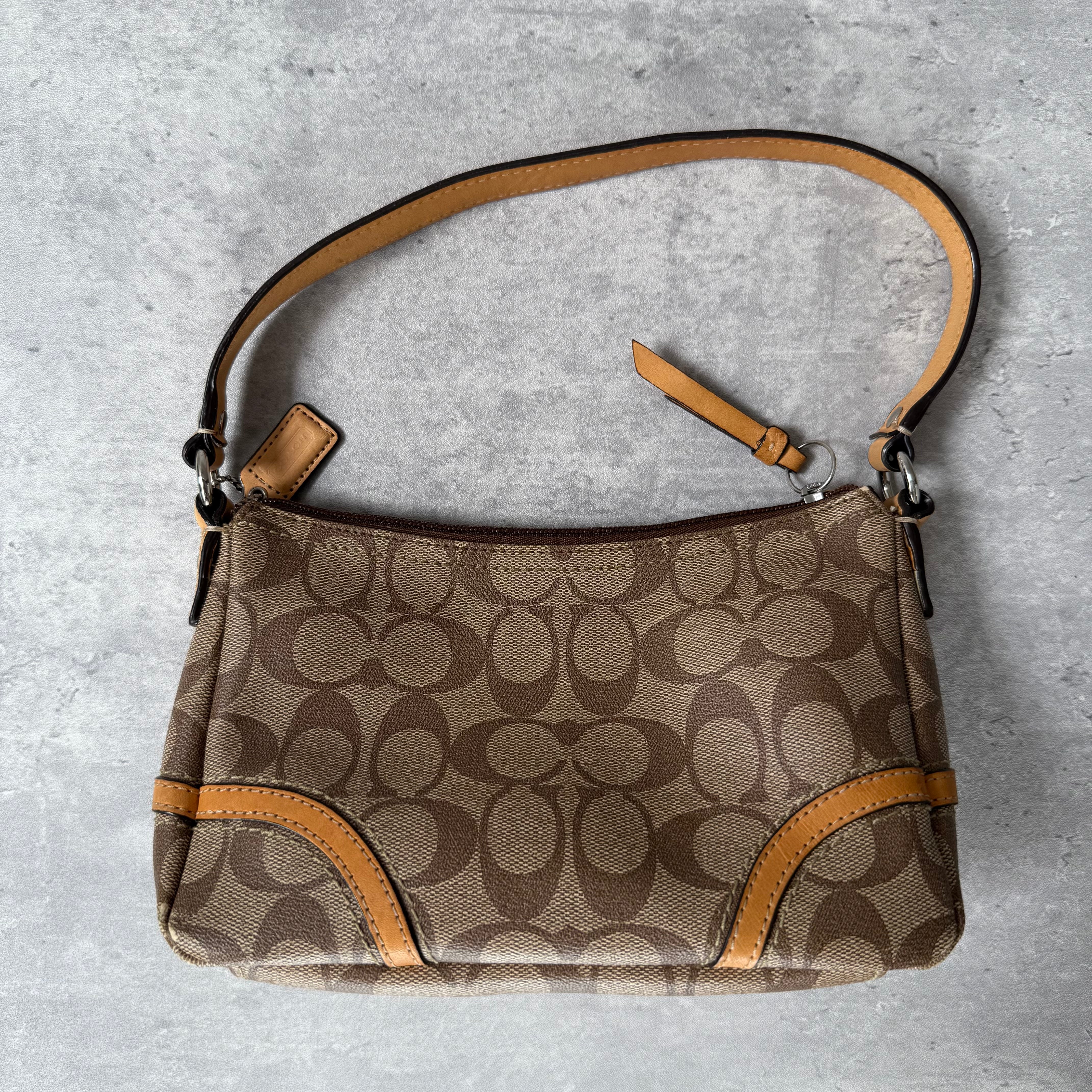 Coach Signature Sufflette Leather Shoulder Bag in beige with monogram canvas, tan leather trim, zip-top closure, and interior slip pocket
