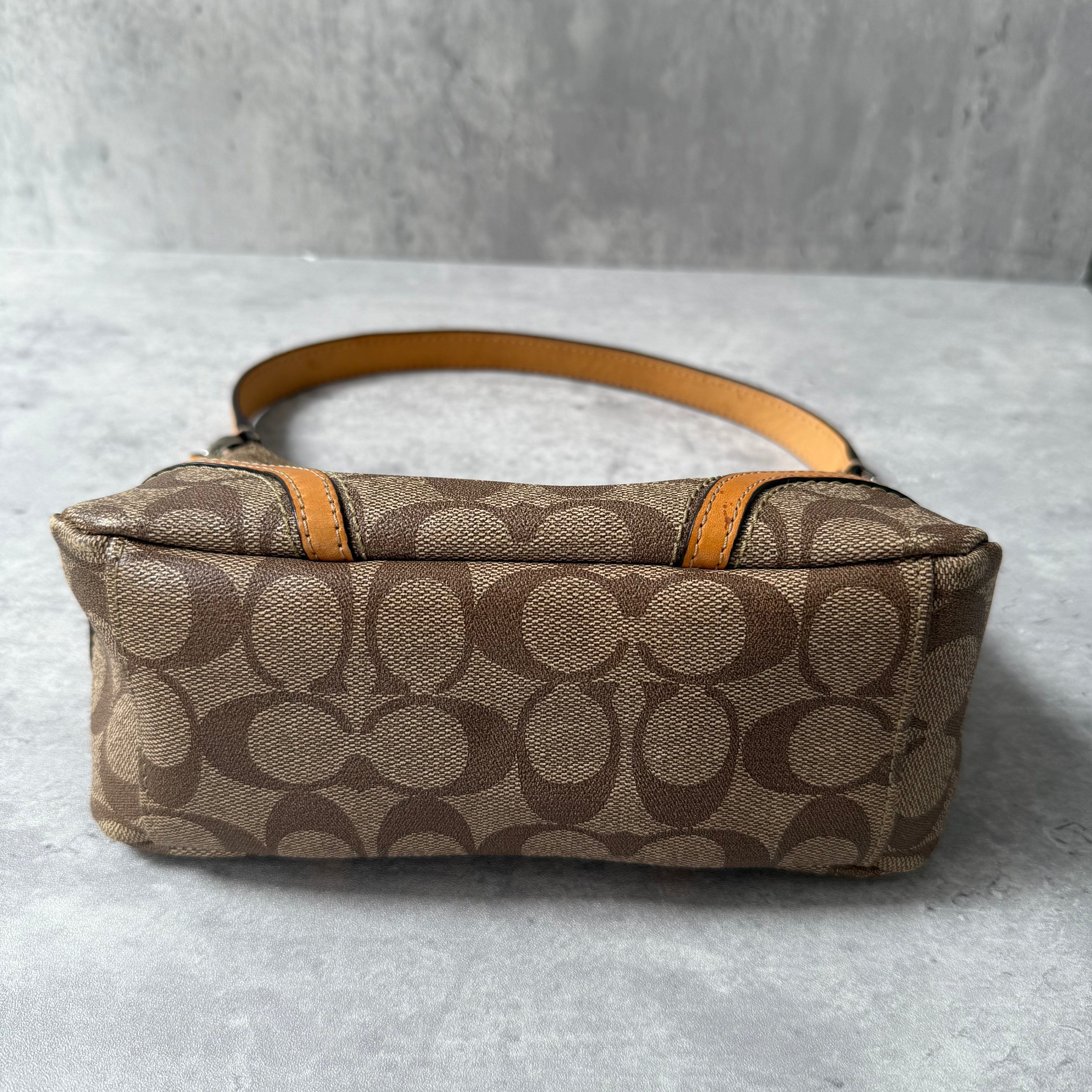 Coach Signature Sufflette Leather Shoulder Bag in beige with monogram canvas, tan leather trim, zip-top closure, and interior slip pocket