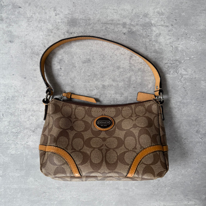 Coach Signature Sufflette Leather Shoulder Bag in beige with monogram canvas, tan leather trim, zip-top closure, and interior slip pocket