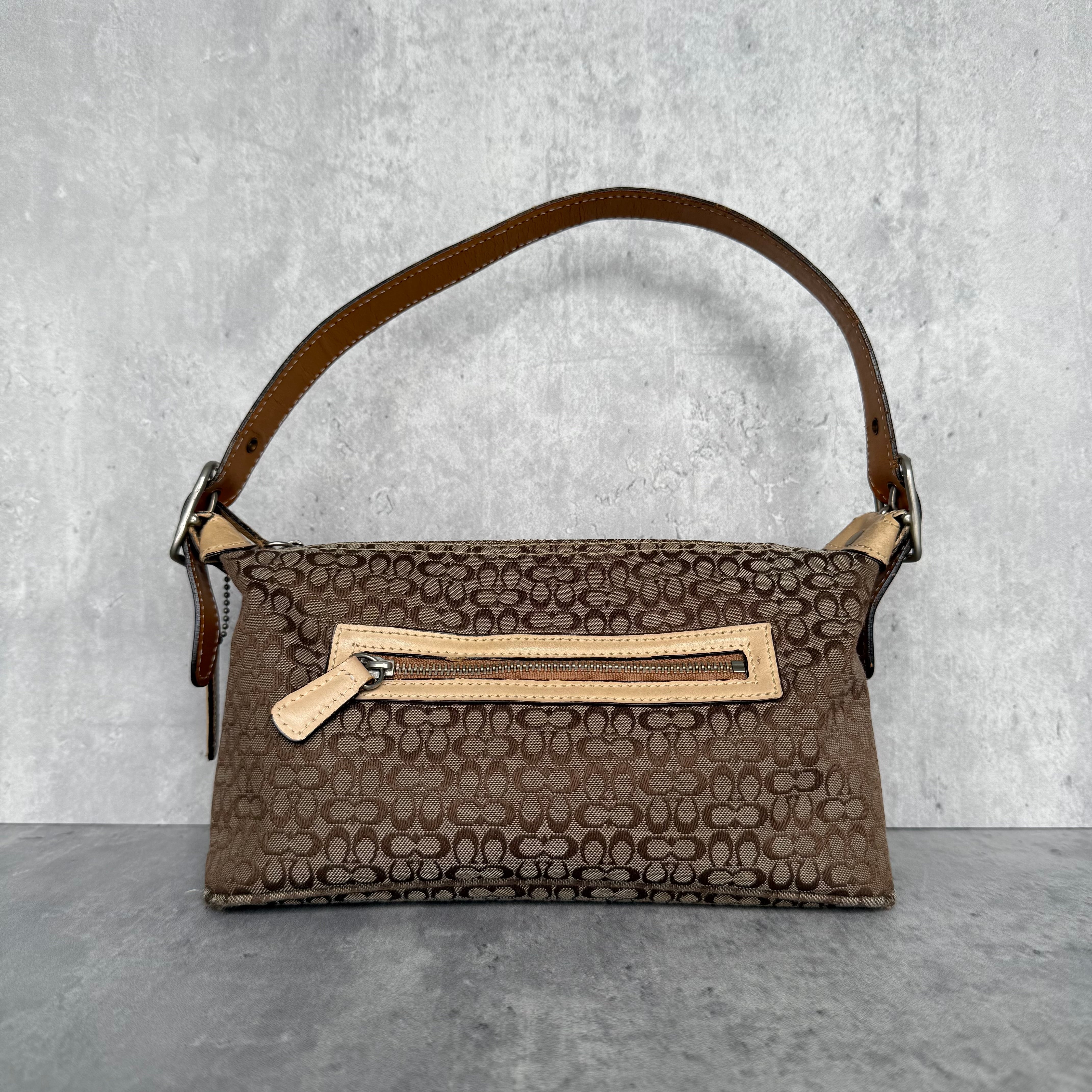 Coach Signature Sufflette Shoulder Bag in beige monogram canvas with cream trim and orange interior