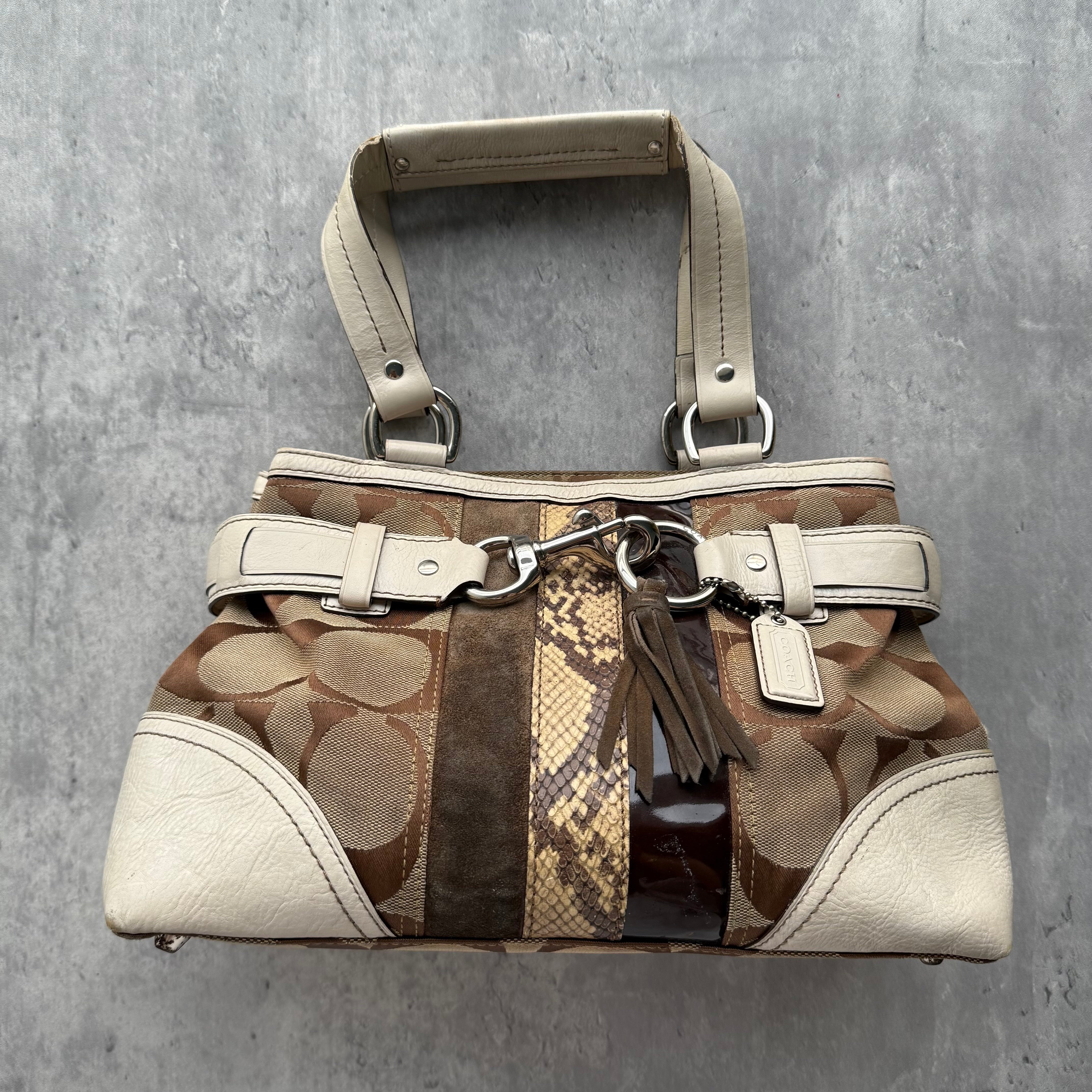 Coach Signature Sufflette Stripe Handbag Multicolor Brown in jacquard canvas with suede, patent, and snakeskin-print accents, featuring cream leather trim and tassel detail.