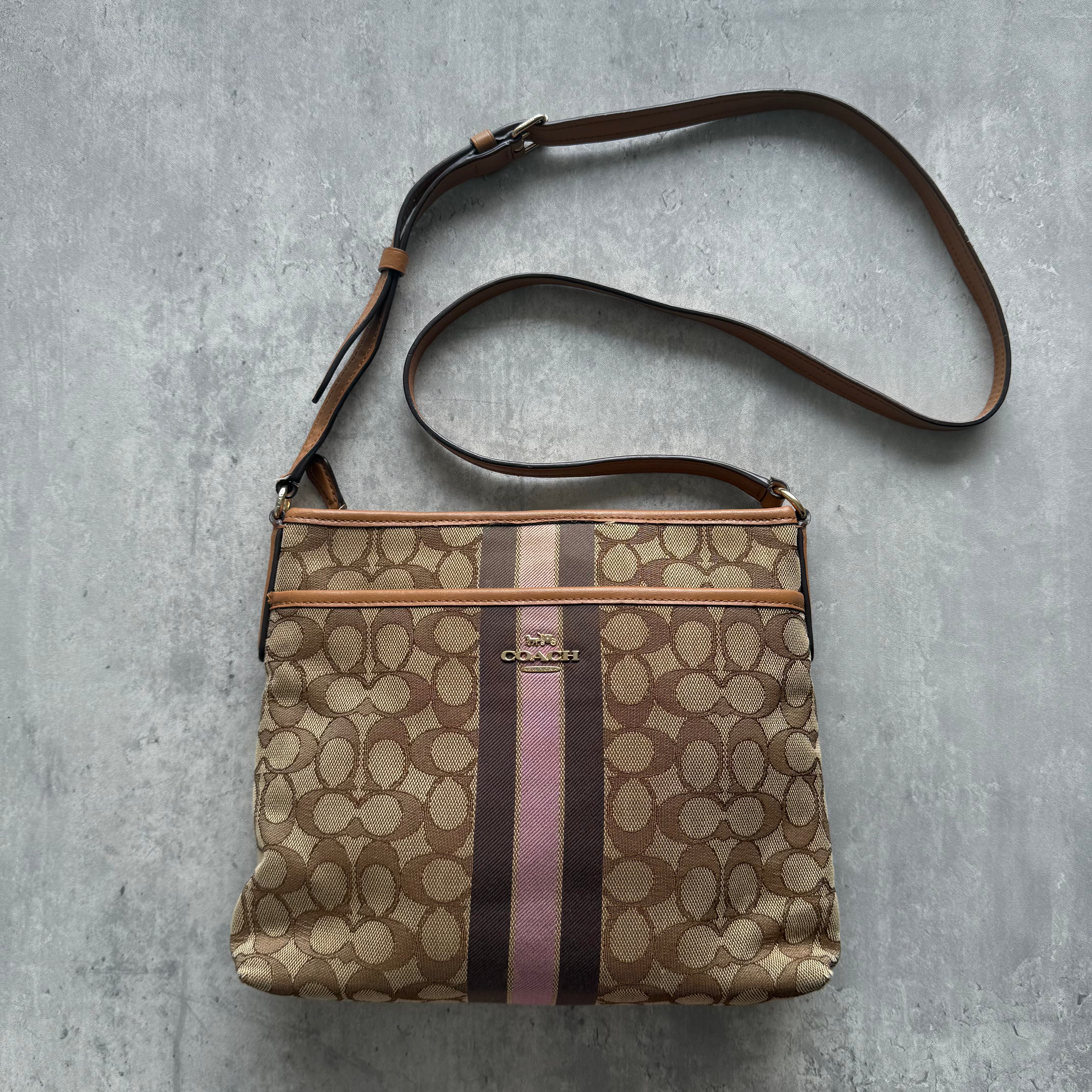 Coach Stripe File Crossbody Bag in beige canvas with pink and brown vertical stripe and adjustable strap.
