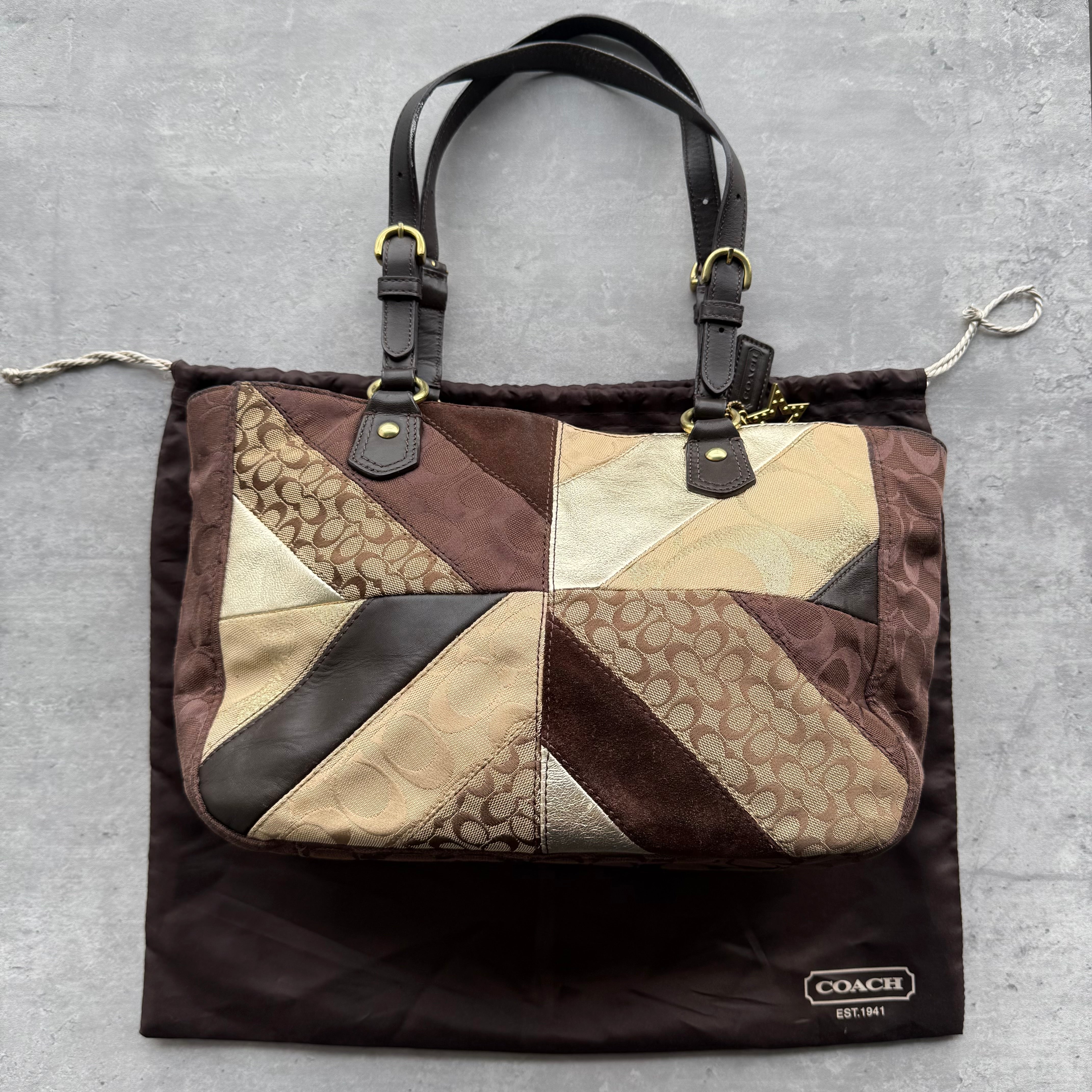 Coach Y2K Chevron Patchwork Tote Bag in brown multicolor jacquard with leather trim and dual handles.