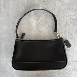 Coach Y2K Demi Shoulder Bag in smooth black leather with contrast stitching, silver hardware, and zip-top closure