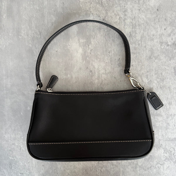 Coach Y2K Demi Shoulder Bag in smooth black leather with contrast stitching, silver hardware, and zip-top closure