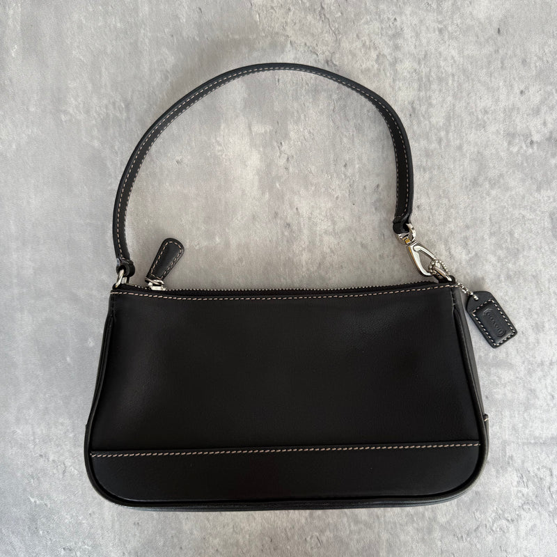 Coach Y2K Demi Shoulder Bag in smooth black leather with contrast stitching, silver hardware, and zip-top closure