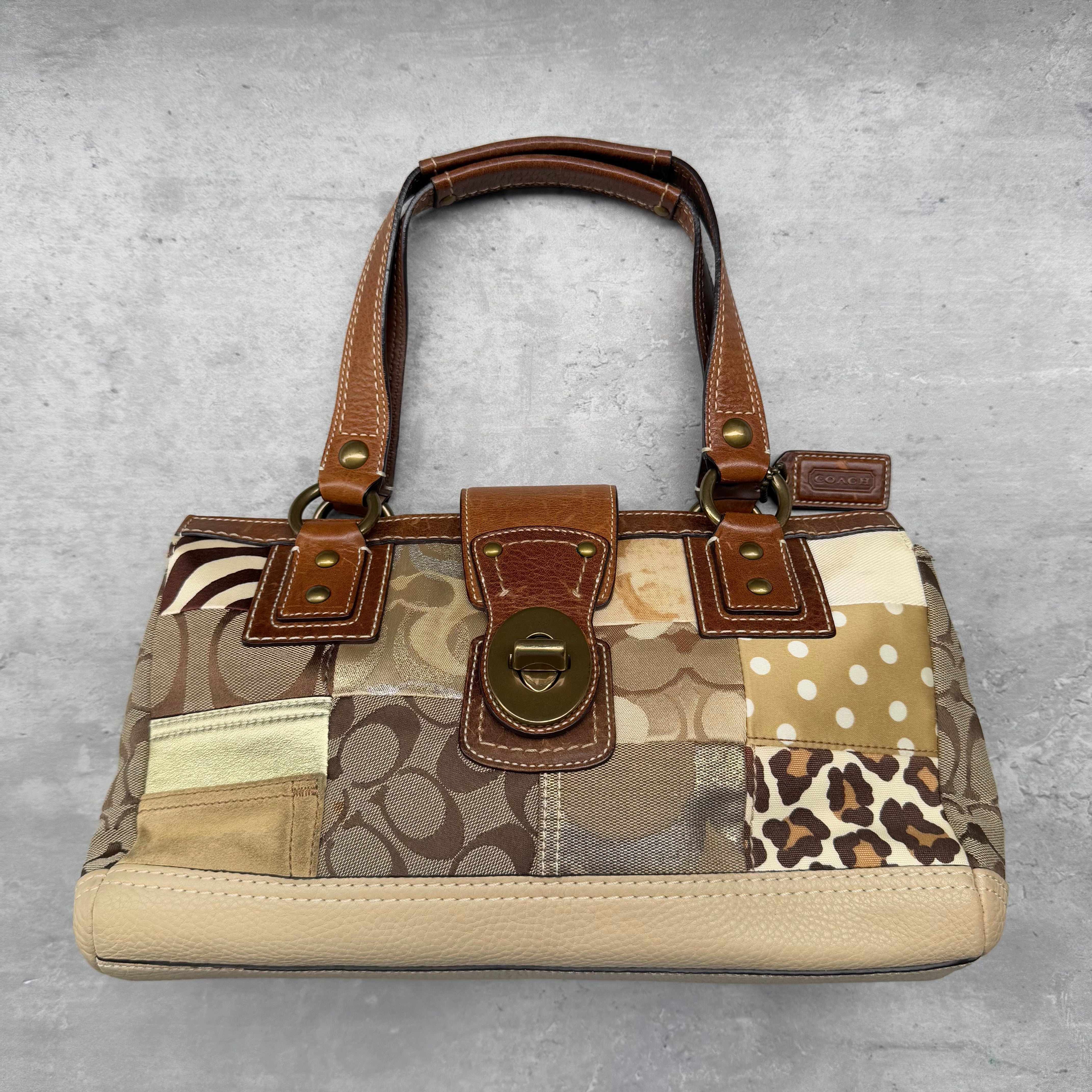 Coach Y2K Signature Soho Patchwork Turnlock Shoulder Bag Brown/Gold, featuring mixed fabric patchwork with polka dot and leopard accents, tan leather trim, and antique brass turnlock closure.