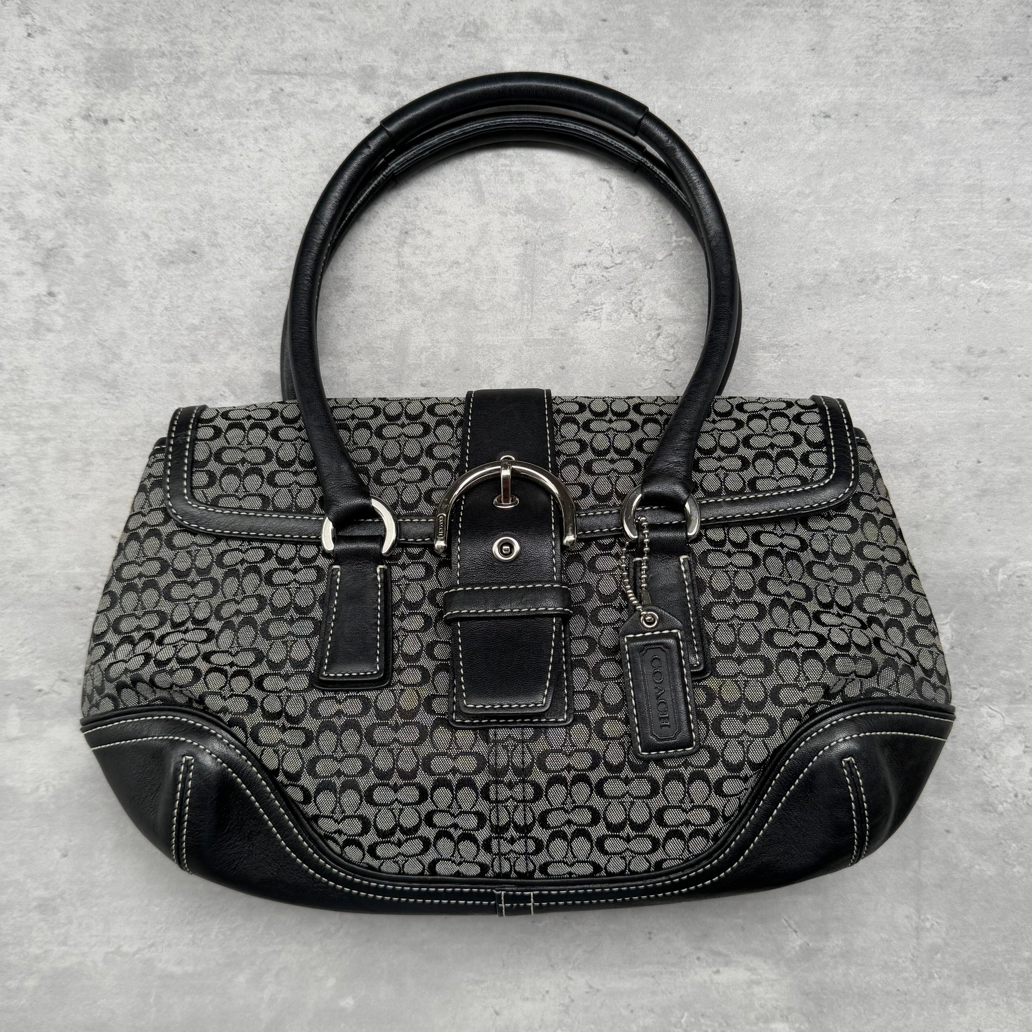 Coach Y2K Soho Shoulder Bag in black and grey jacquard canvas with leather trim, featuring buckle detail and dual top handles.