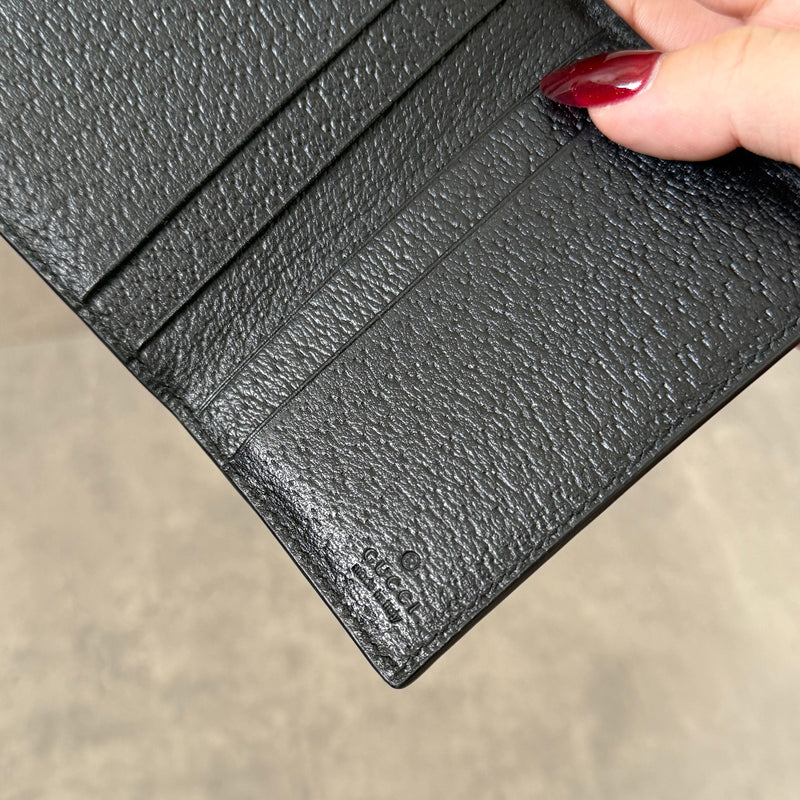 Gucci Interlocking G Black Leather Cardholder, featuring pebbled leather and silver-tone logo hardware in a slim bifold design