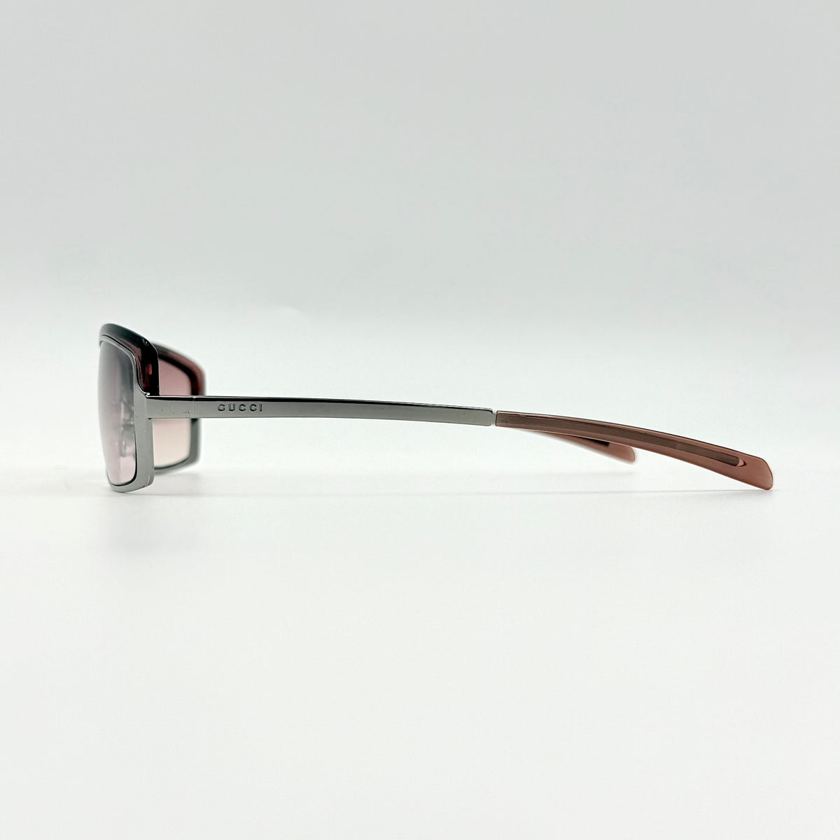 Gucci GG2689/S rectangle sunglasses in silver with pink gradient lenses, shown with case and cloth.