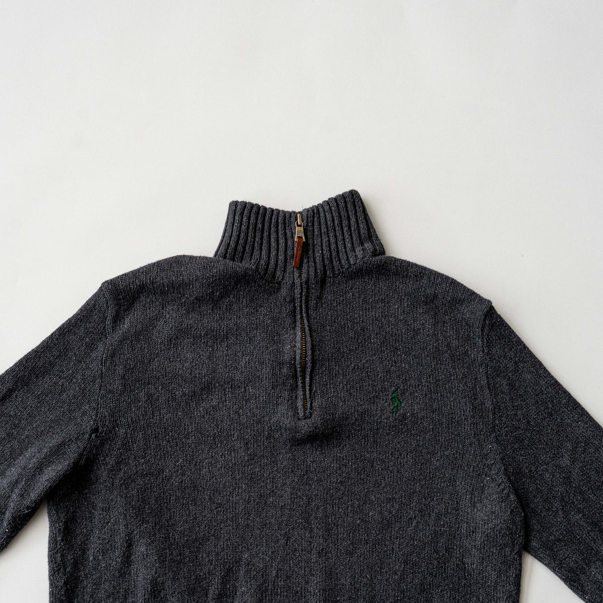 Dark grey Polo Ralph Lauren quarter zip mockneck pullover sweater with ribbed collar and green pony logo.