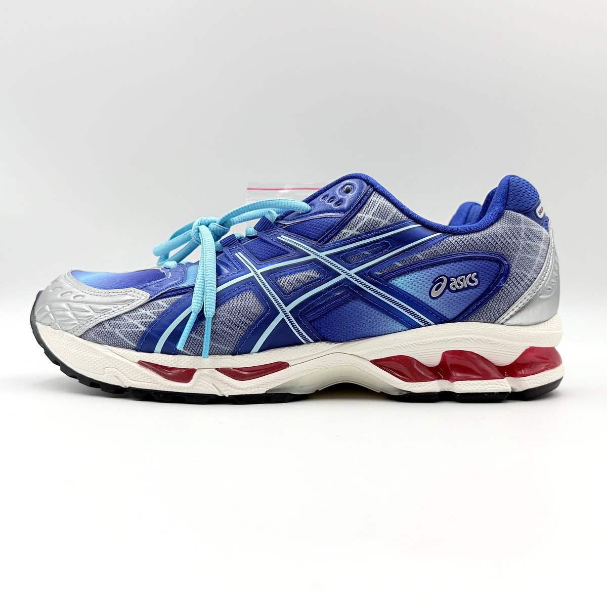 ASICS x KITH Gel-Nimbus 10.1 Mega Man sneakers in bold blue and silver, displayed with extra laces and distinctive collaboration details.