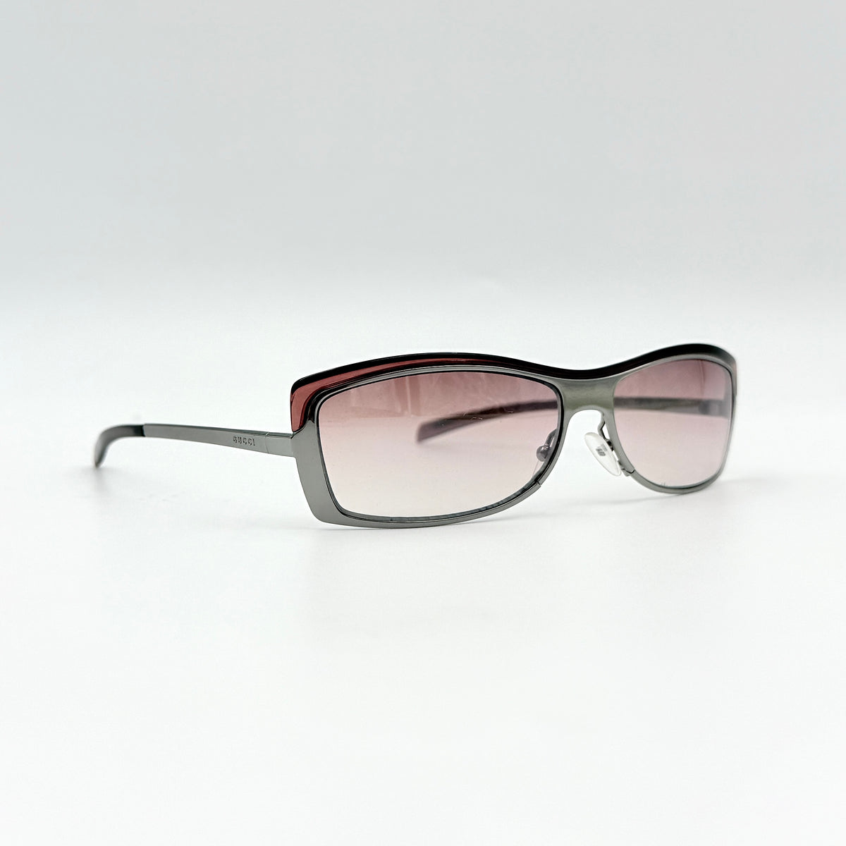Gucci GG2689/S rectangle sunglasses in silver with pink gradient lenses, shown with case and cloth.
