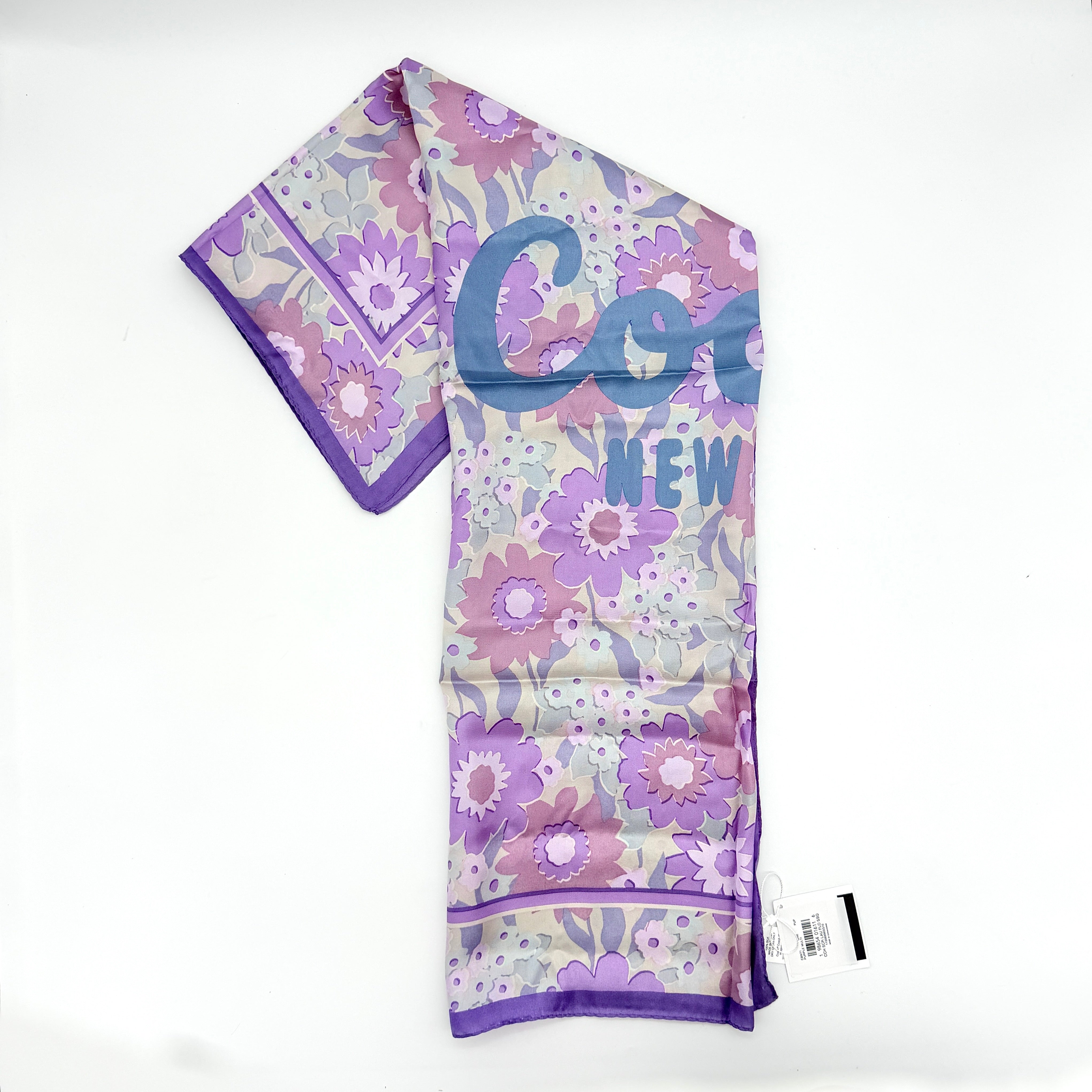 Coach floral silk scarf in purple with logo, presented with original packaging and tags.