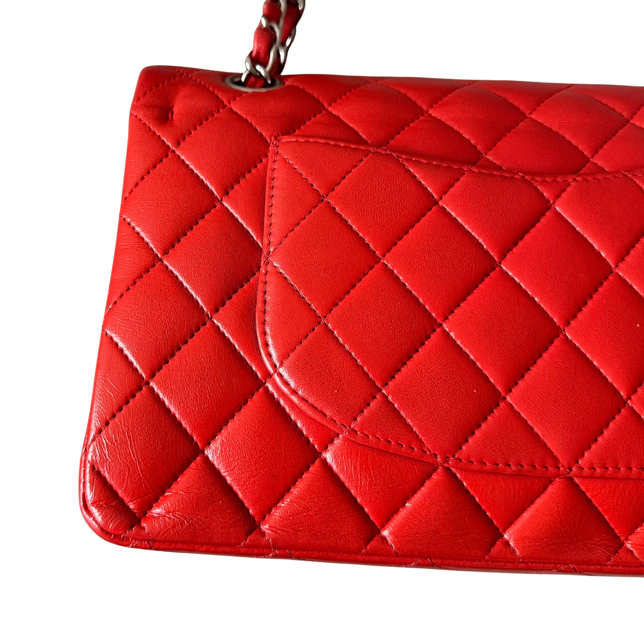Chanel double flap shoulder bag in quilted red leather with silver-tone hardware and chain leather strap.
