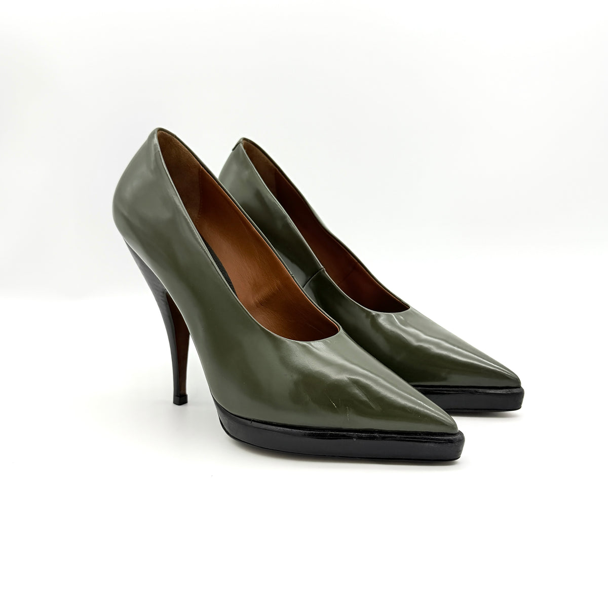 Celine olive green leather heels with pointed toe and black stiletto heel, displayed against a white background