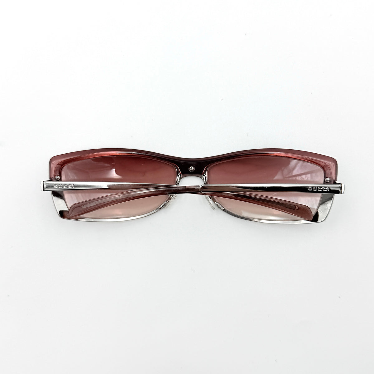 Gucci GG2689/S rectangle sunglasses in silver with pink gradient lenses, shown with case and cloth.