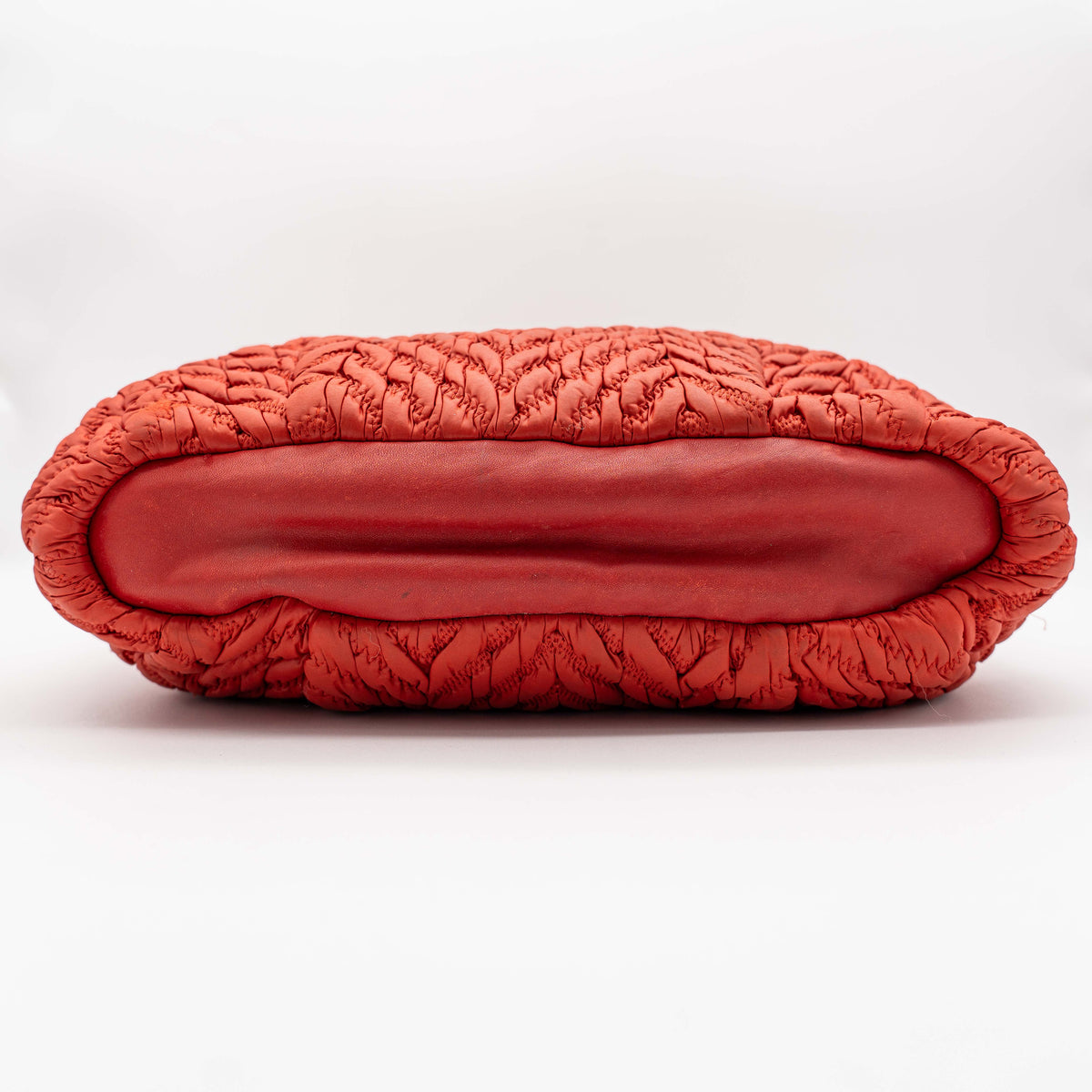 Coach Madison 2Way shoulder bag in rich red quilted texture with gold hardware, top handles, and detachable strap, displayed on a white background.