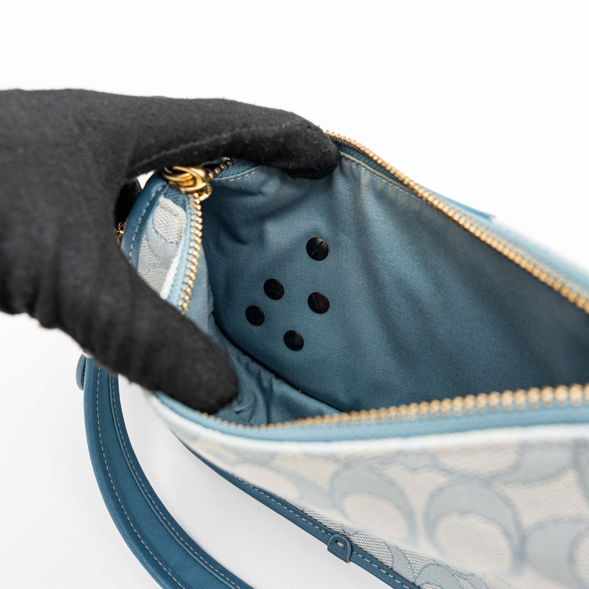 Coach 2Way Signature Swinger Shoulder Bag in light blue monogram canvas and leather with dinosaur and rainbow patches, shown with detachable strap.