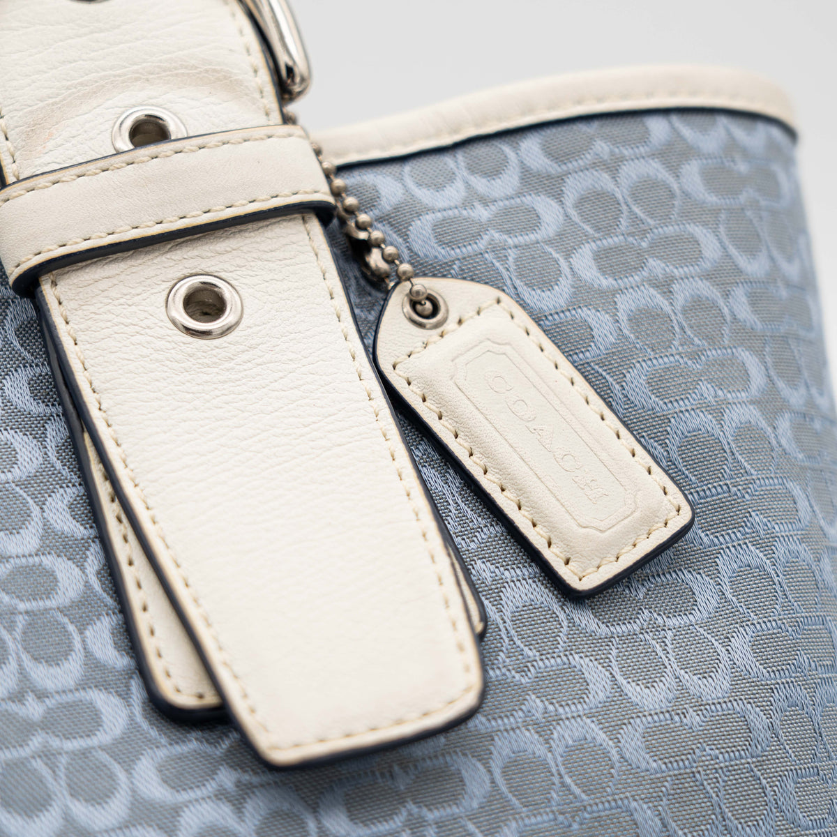 Coach Y2K Signature Soho Buckle Tote in light blue jacquard with white leather trim and silver-tone hardware.
