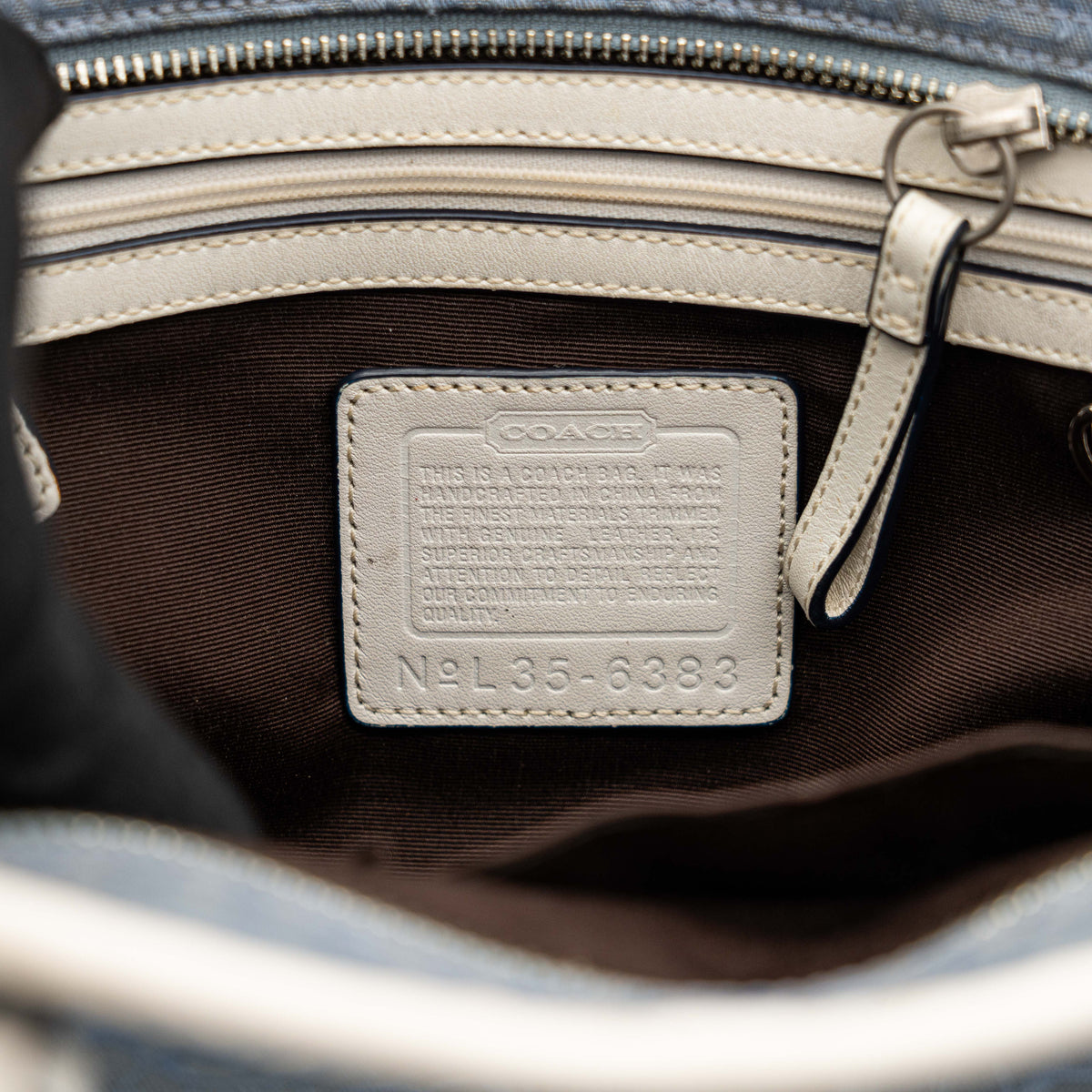 Coach Y2K Signature Soho Buckle Tote in light blue jacquard with white leather trim and silver-tone hardware.