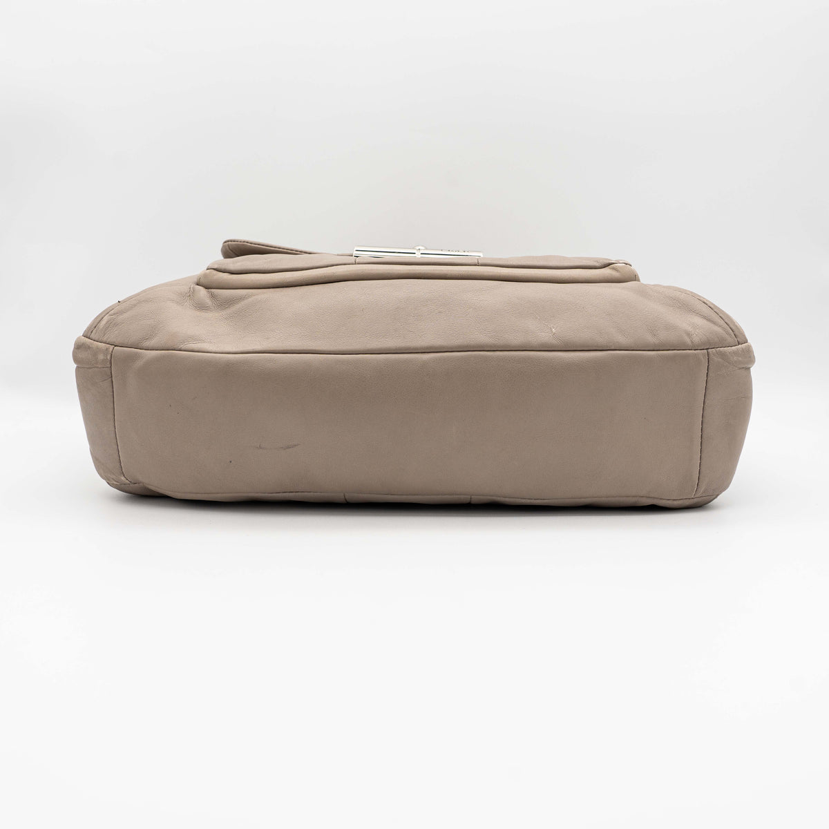 Coach Kristin East West Shoulder Bag in beige leather with silver-tone hardware and double handles.